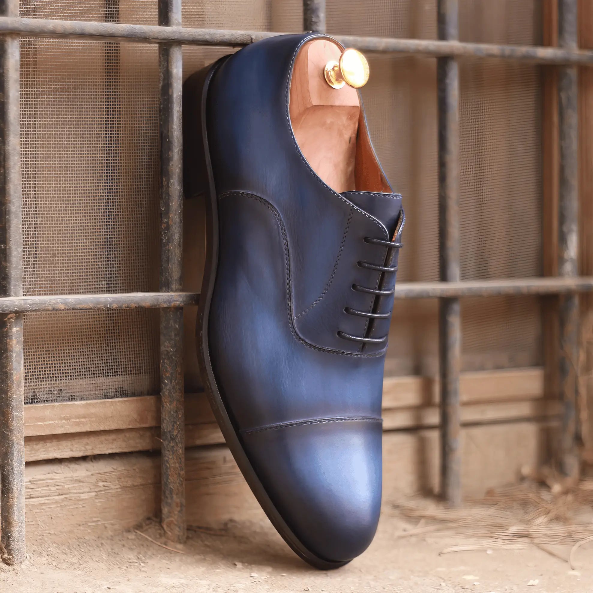 Blue leather dress shoe.