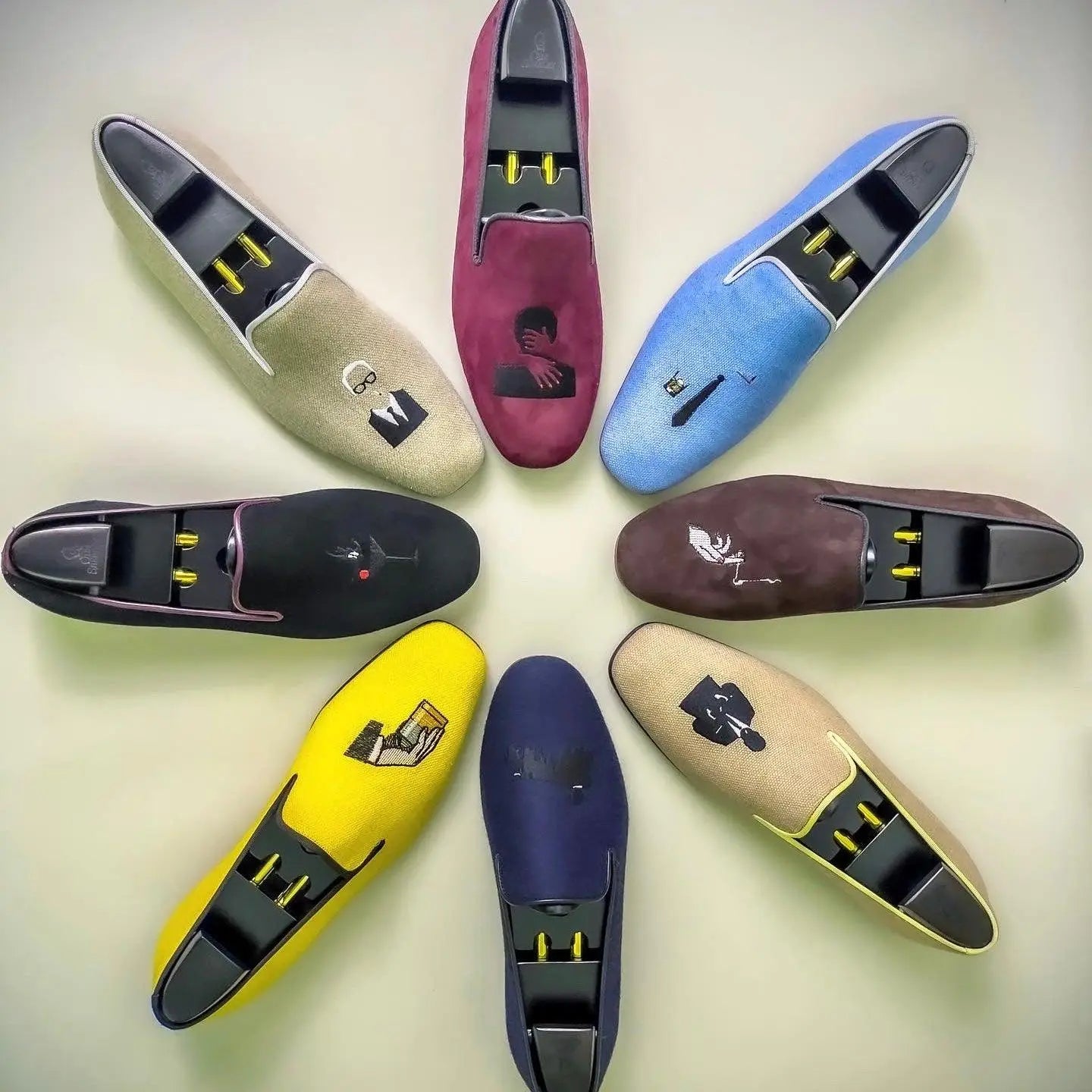 Colorful slip-on dress shoes with unique designs.