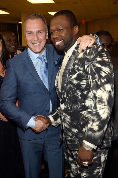 Two men shaking hands.