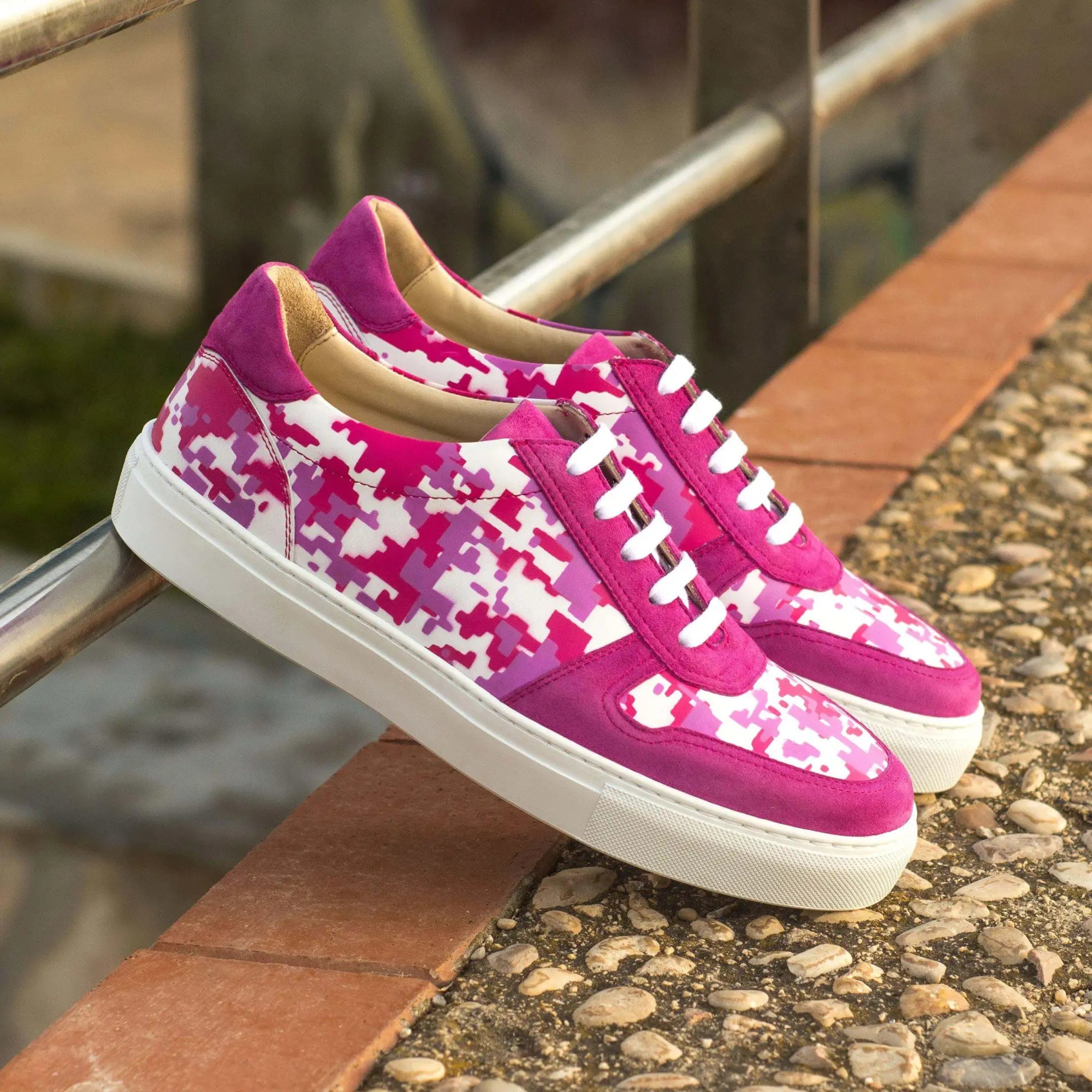 Pink and white camouflage sneakers.