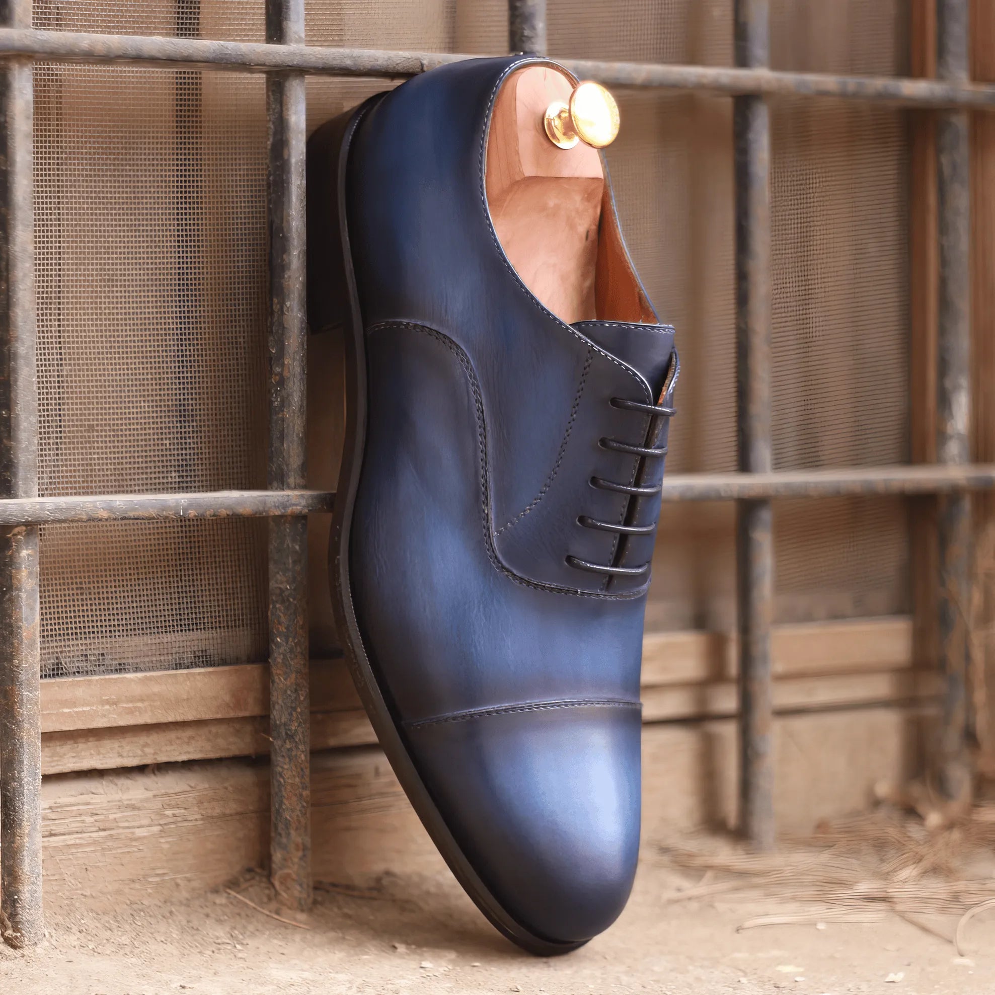 Blue leather 1939 Oxford patina shoes showcasing exquisite craftsmanship and elegance