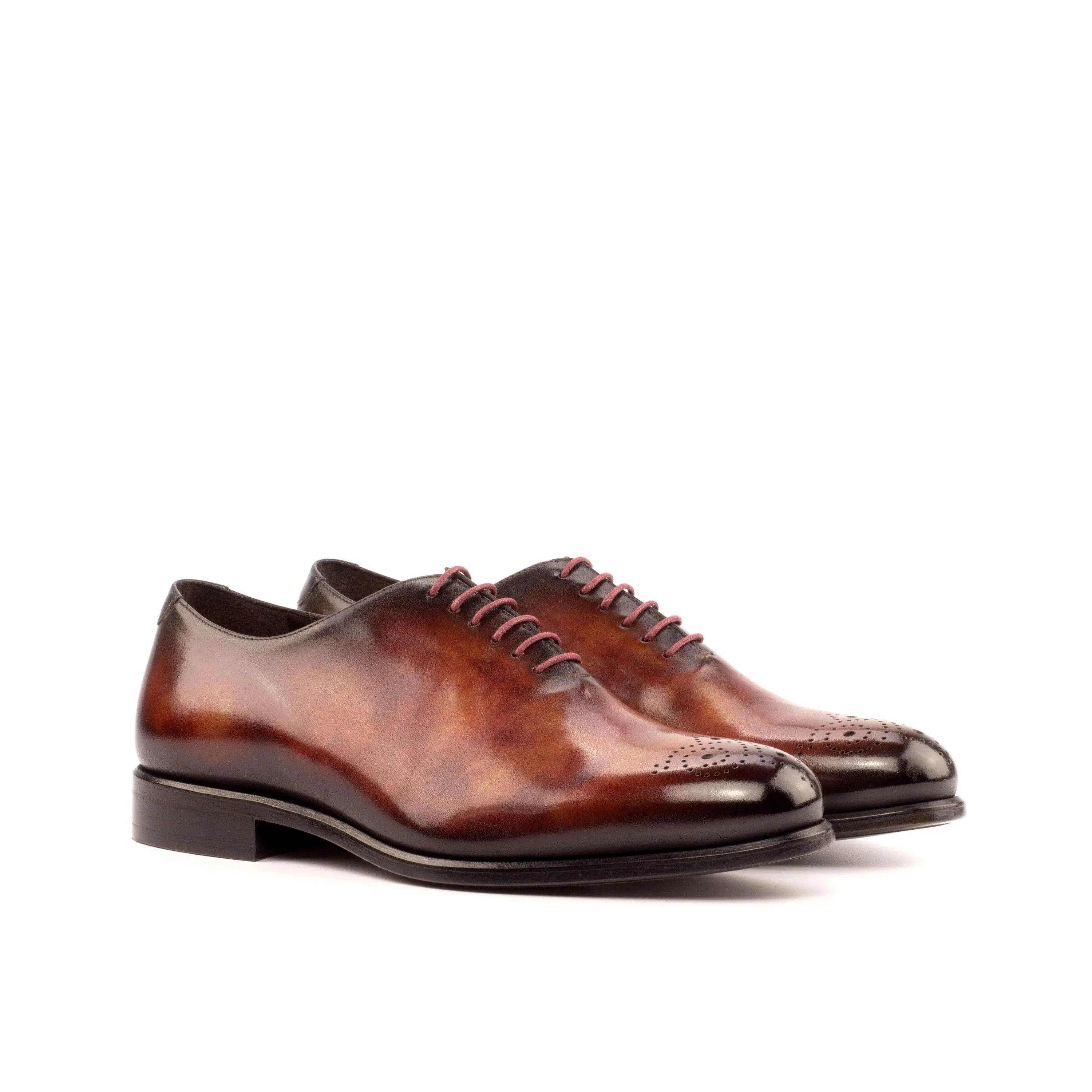 Pair of brown leather dress shoes 50 Whole Cut Patina II showcasing luxury bespoke shoes for men