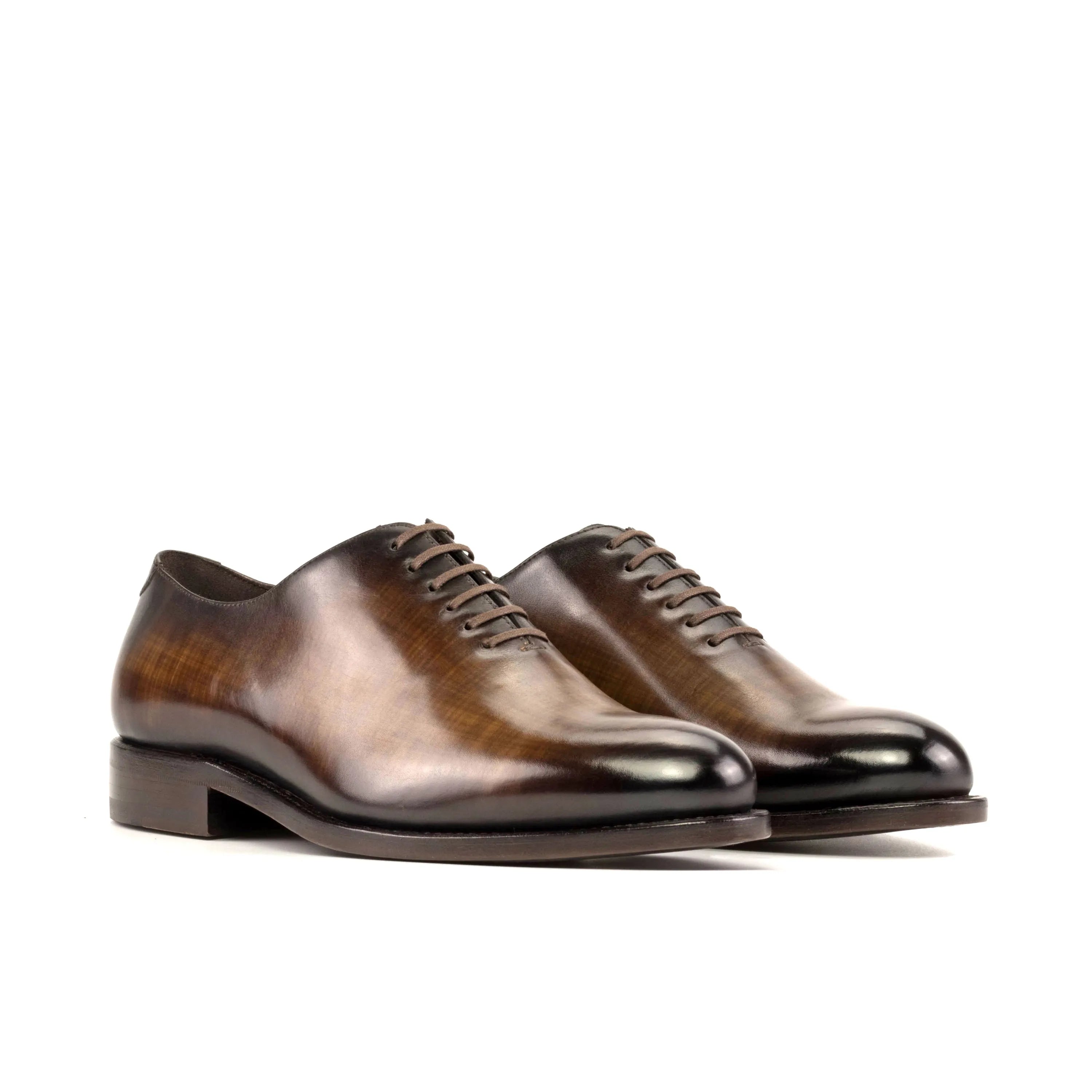 Pair of brown leather 5907 Whole Cut Patina Shoes showcasing exquisite cut patina