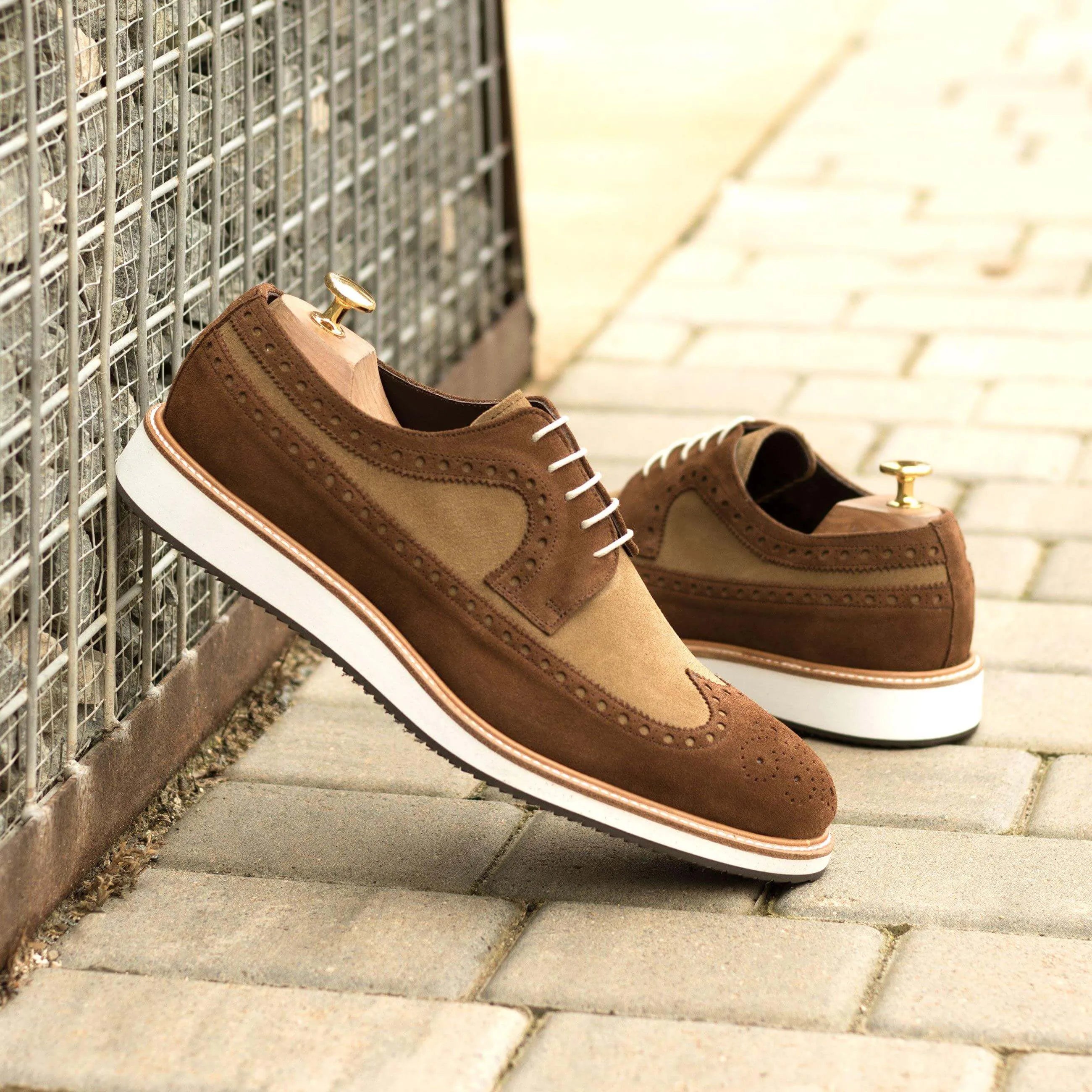 Brown suede 99G Longwing Blucher shoes featuring a classic wingtip design