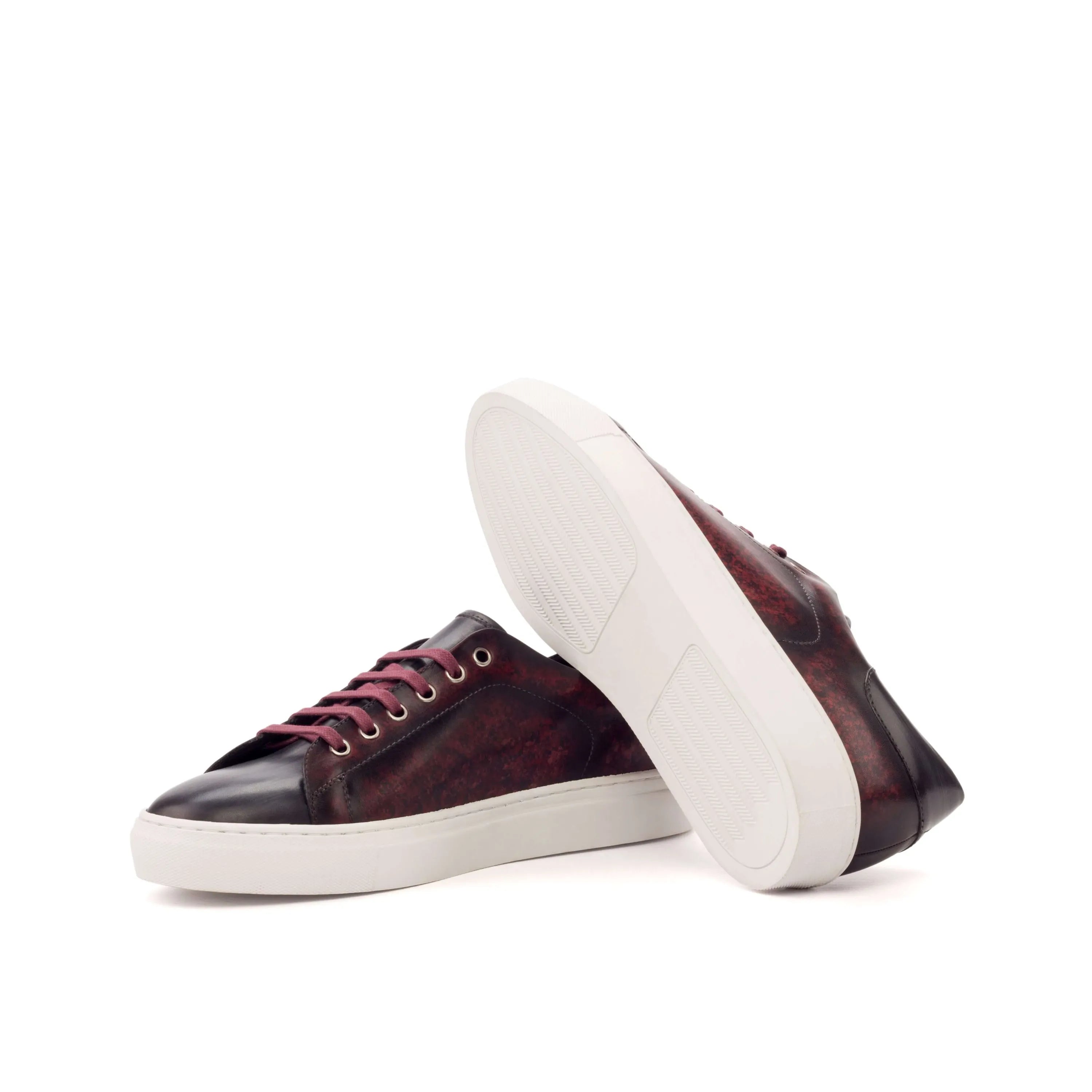 Burgundy leather Abril Trainer Patina Sneaker II with crust patina finish displayed