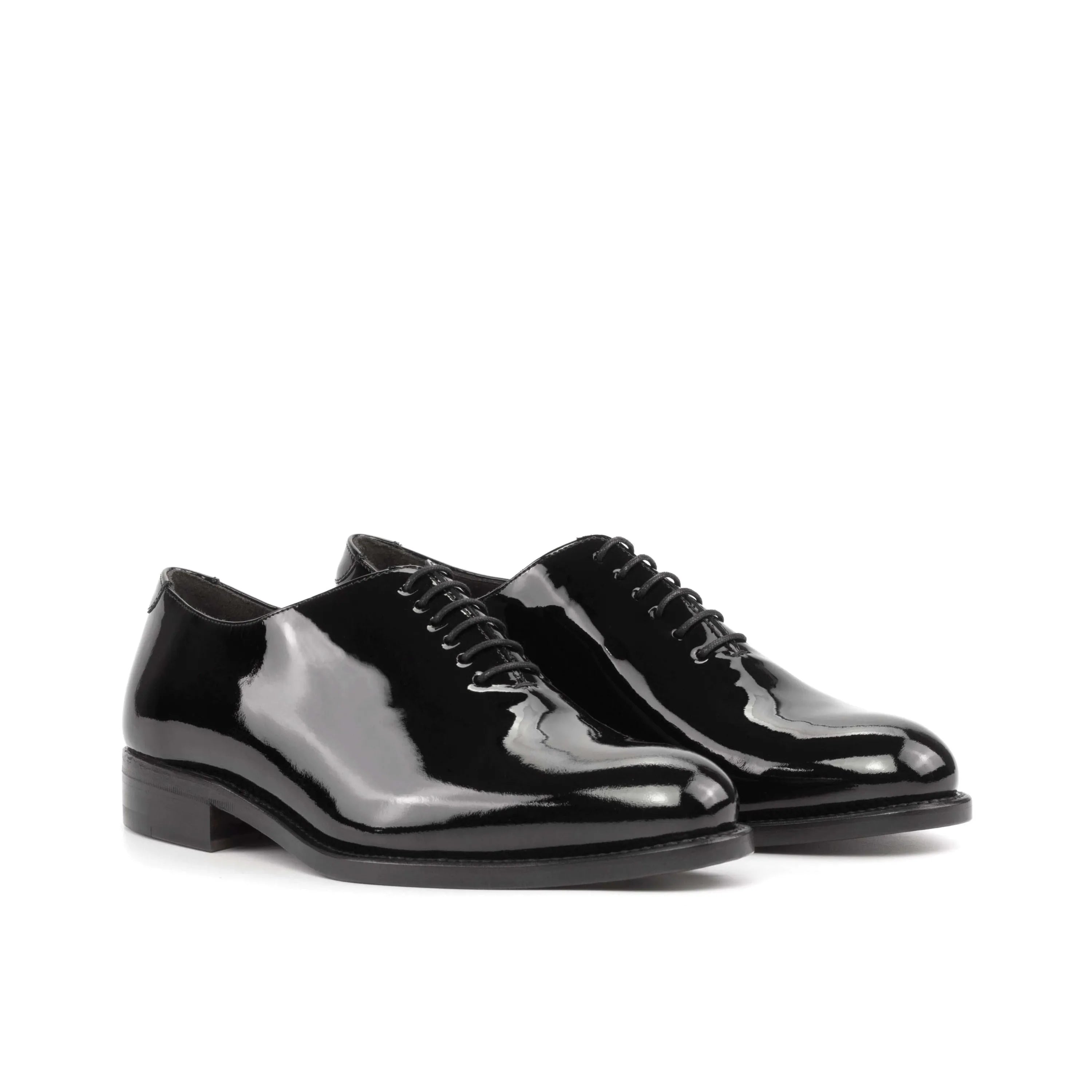 Pair of shiny black Agent Wholecut shoes II showcasing elegant craftsmanship and style