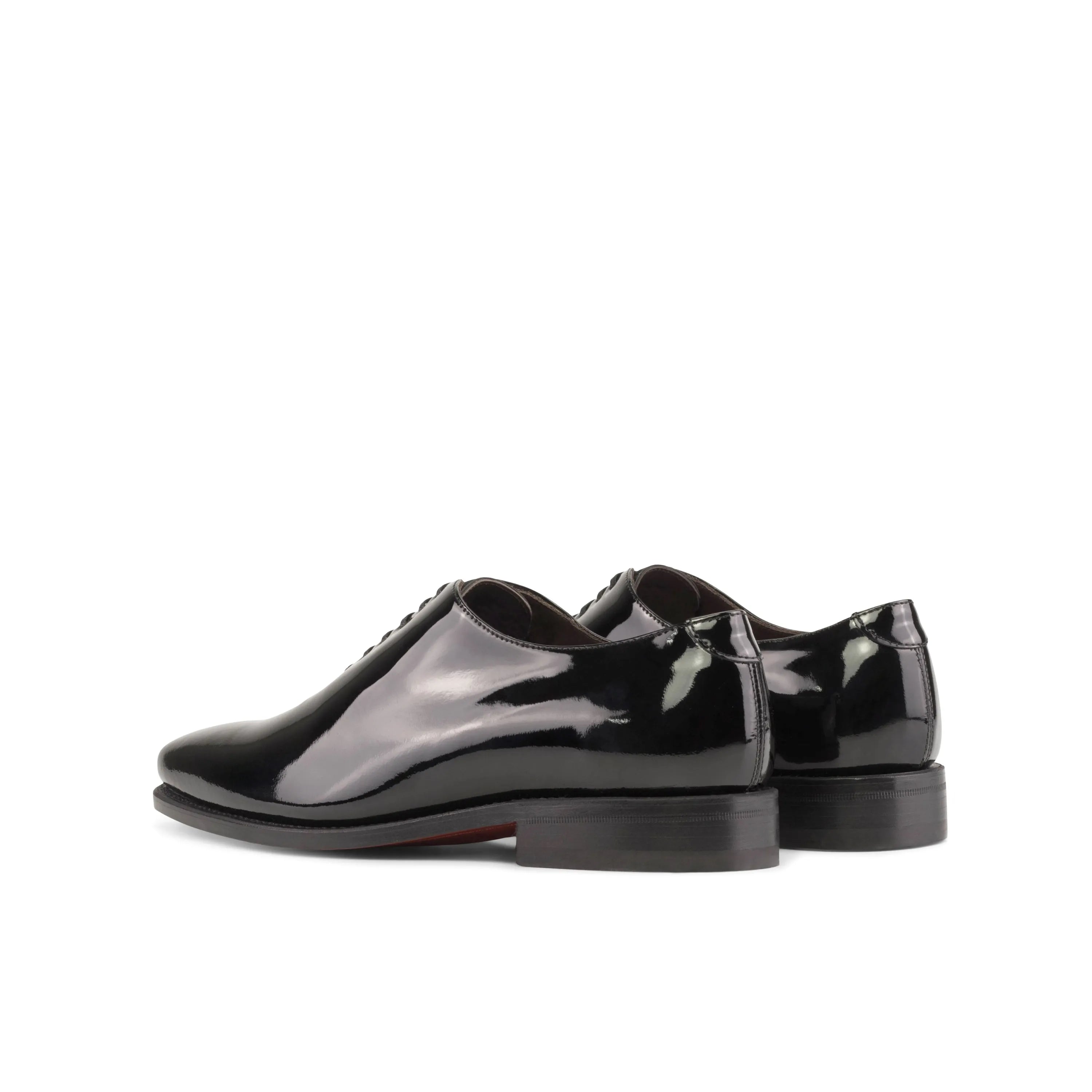 Pair of shiny black dress shoes from Agent2 Wholecut Shoes II for formal elegance