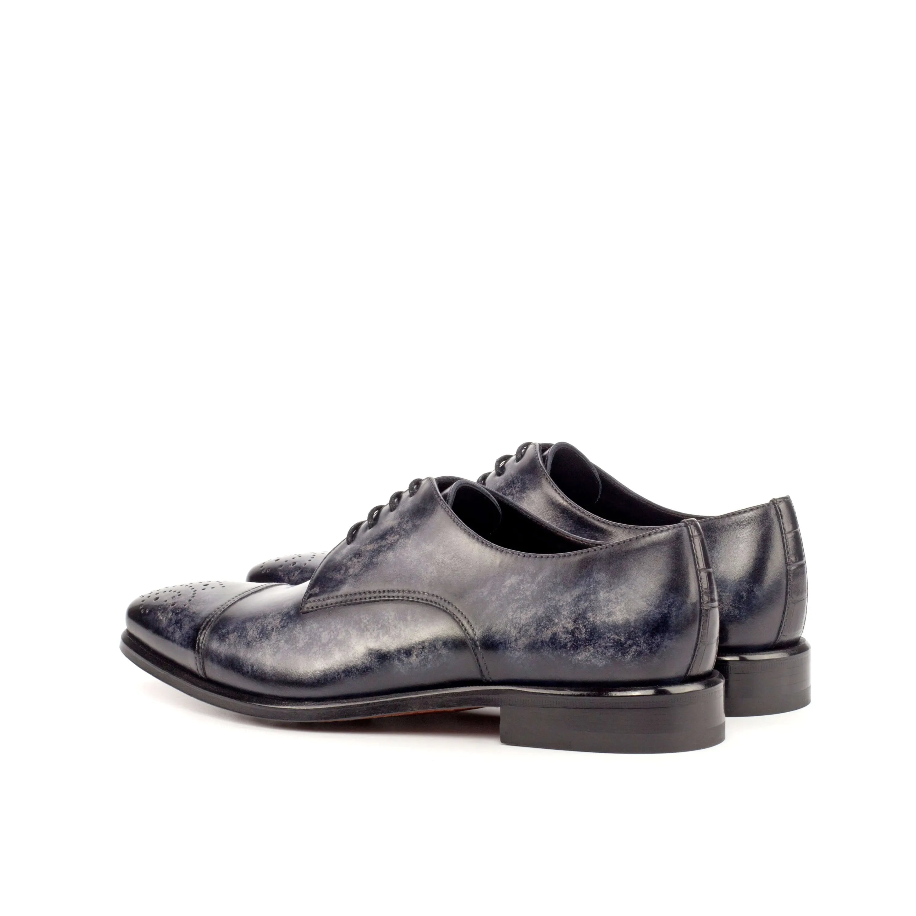 Pair of blue leather AL94 Patina Derby shoes showcasing elegant craftsmanship