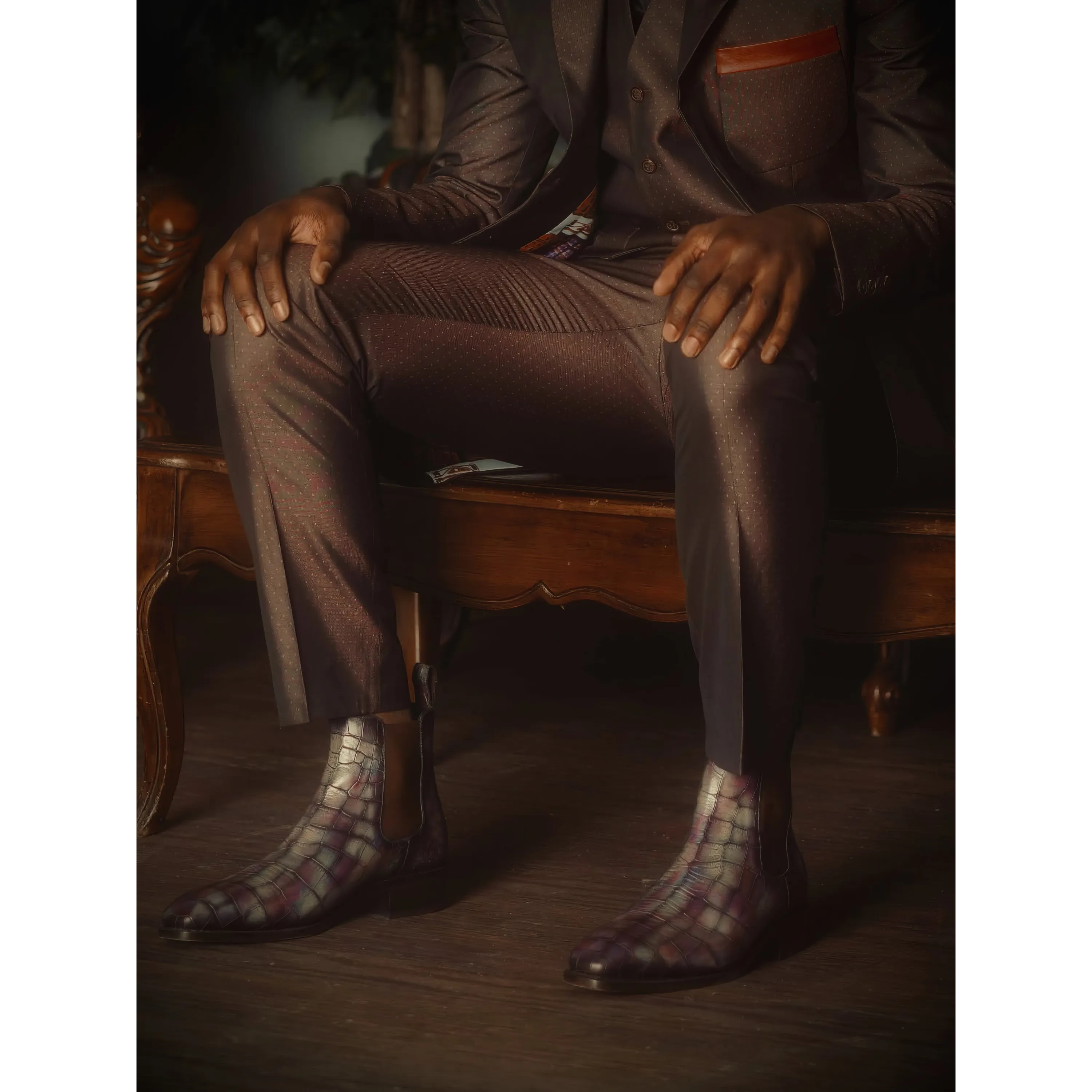 Man in a suit showcasing Alexandrio Patina Chelsea Boots II with stylish patterned design