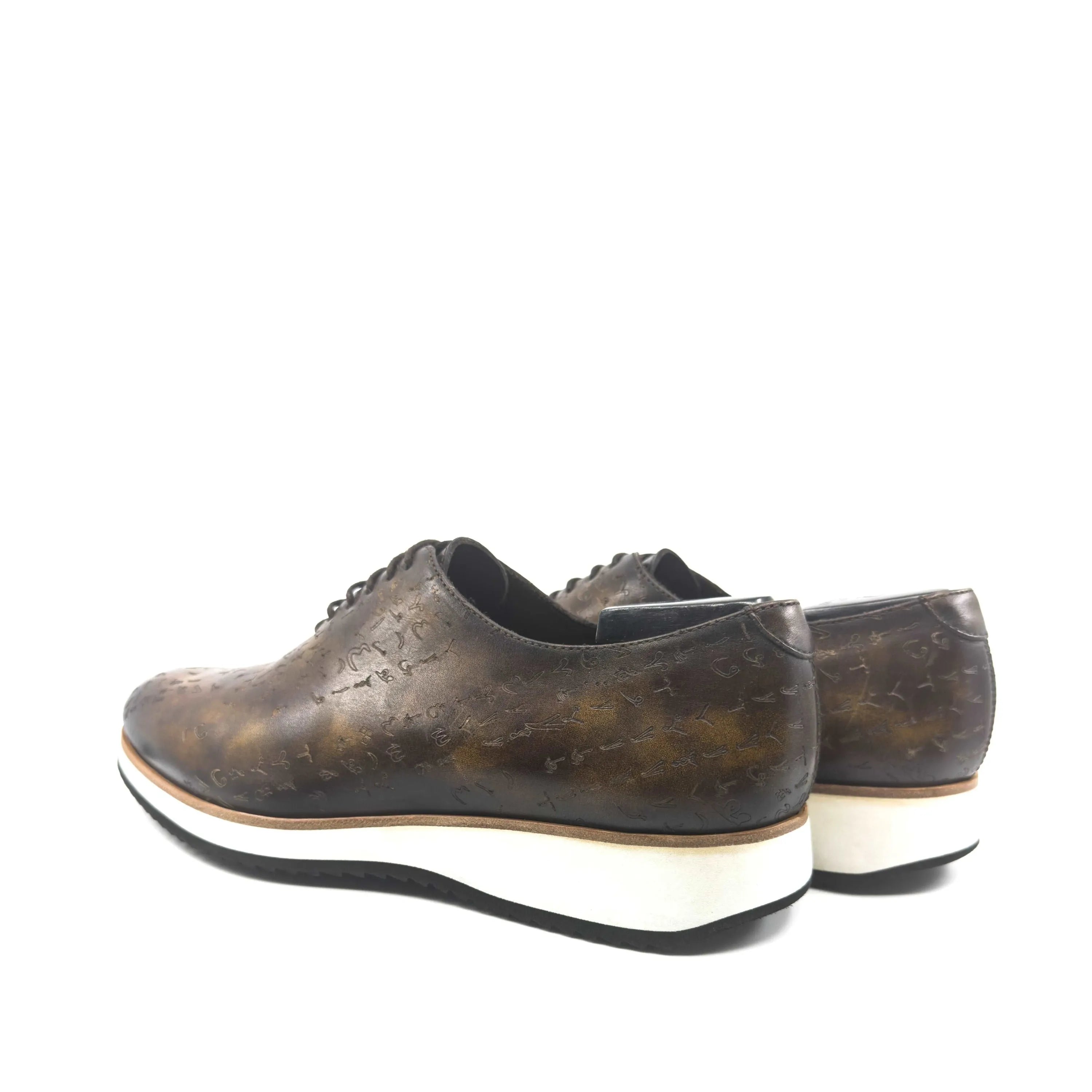 Brown leather dress shoes with white soles, featuring Italian crust leather and Matrix II patina