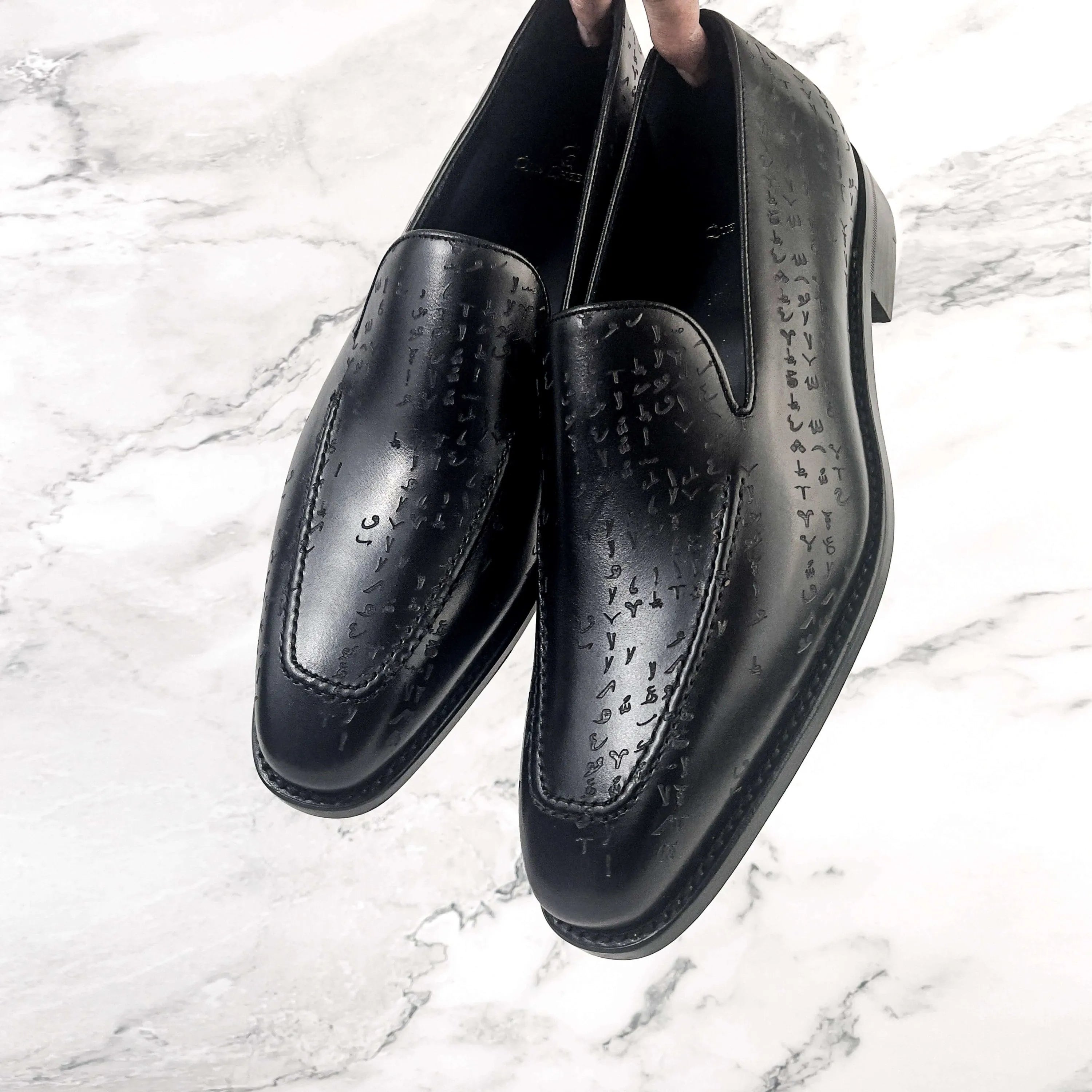 Pair of Arabic Matrix Loafers in Black Edition crafted from Italian Crust Leather
