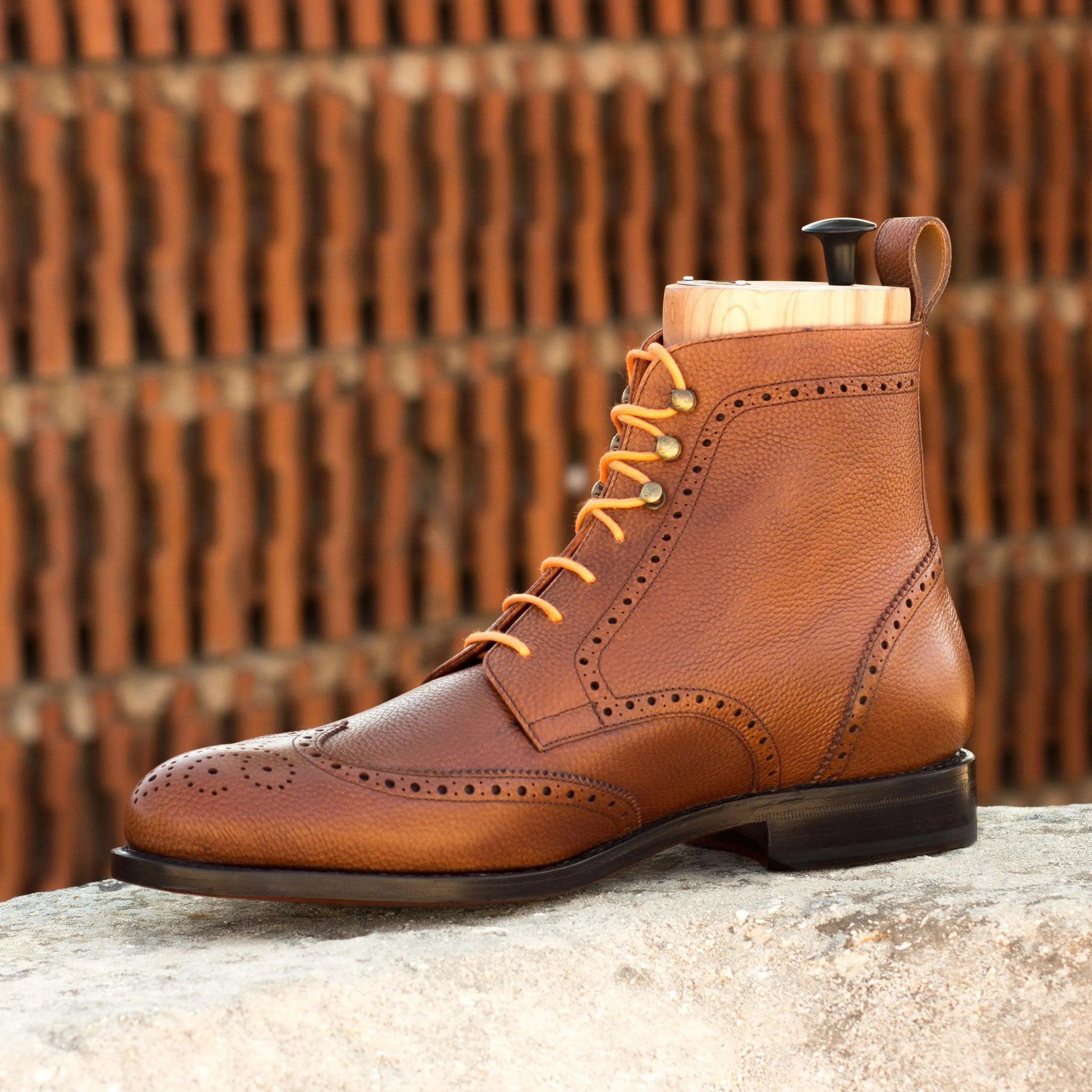 Brown leather wingtip boot from Aram Military Brogue Boots II, showcasing classic style