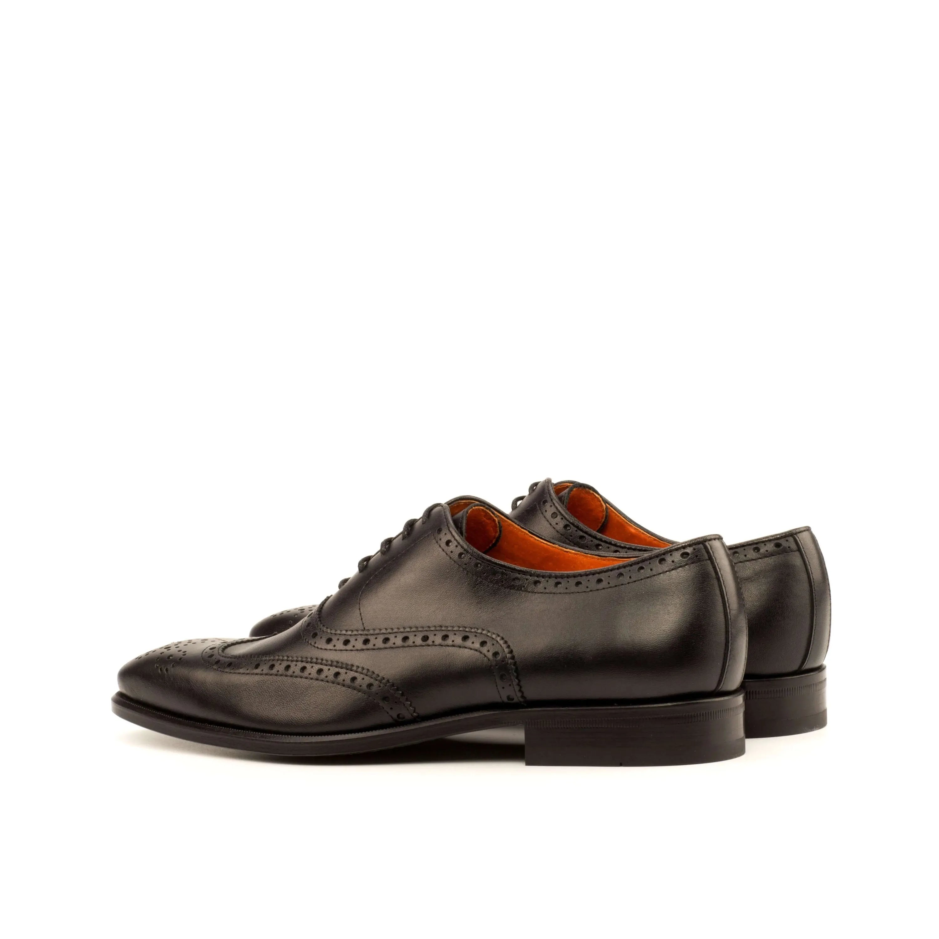 Pair of black leather wingtip brogue shoes from Awan, luxury bespoke shoes for men