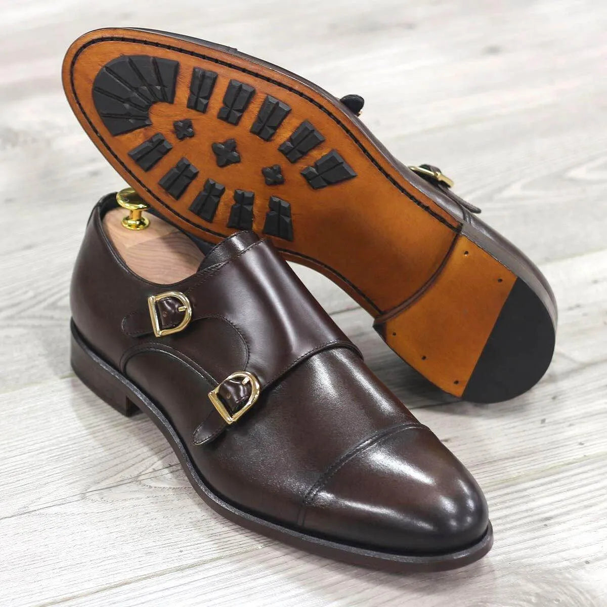 Brown leather Bako Double Monk Shoes featuring a sophisticated patina finish