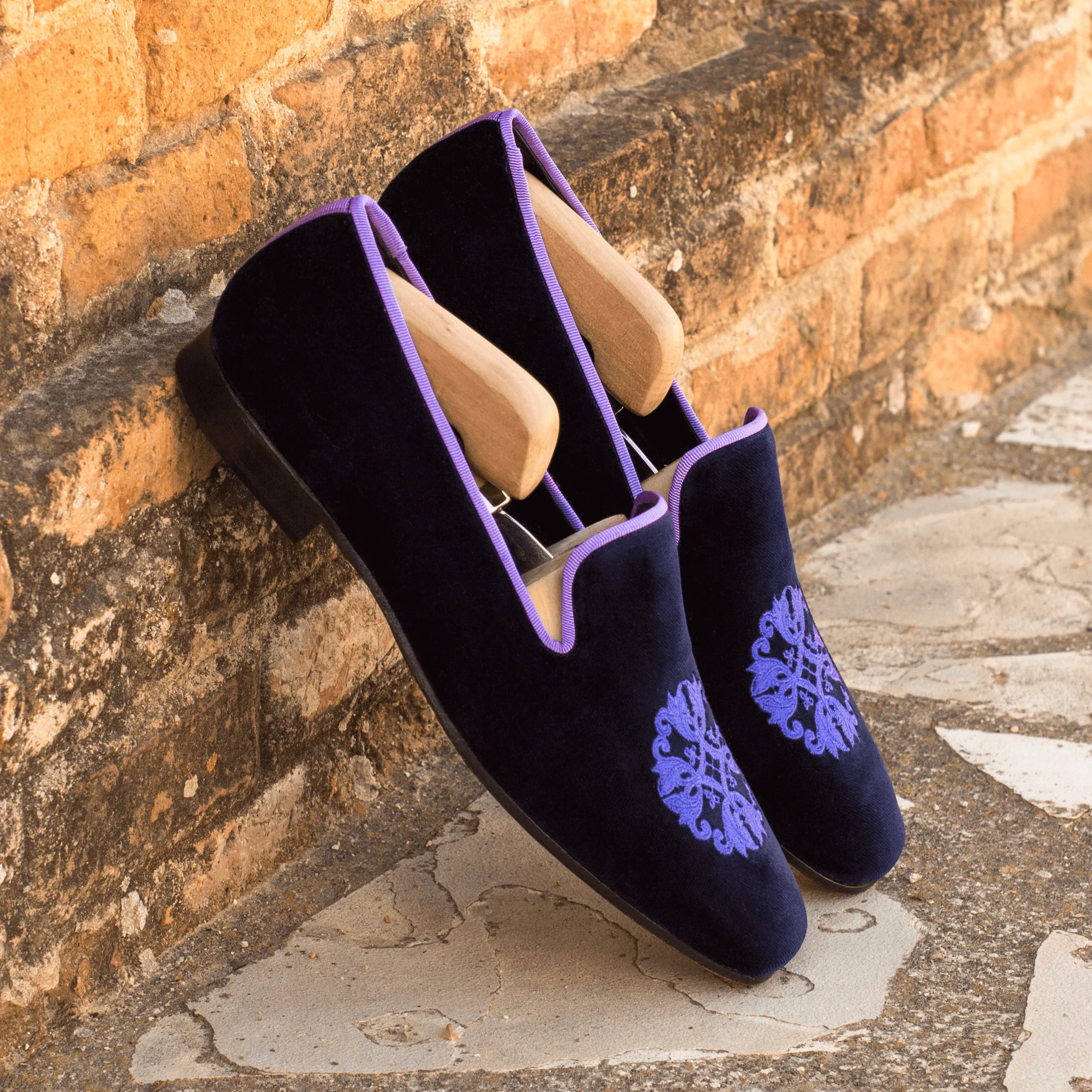 Navy velvet slippers with purple trim from the Bali Drake slipon collection
