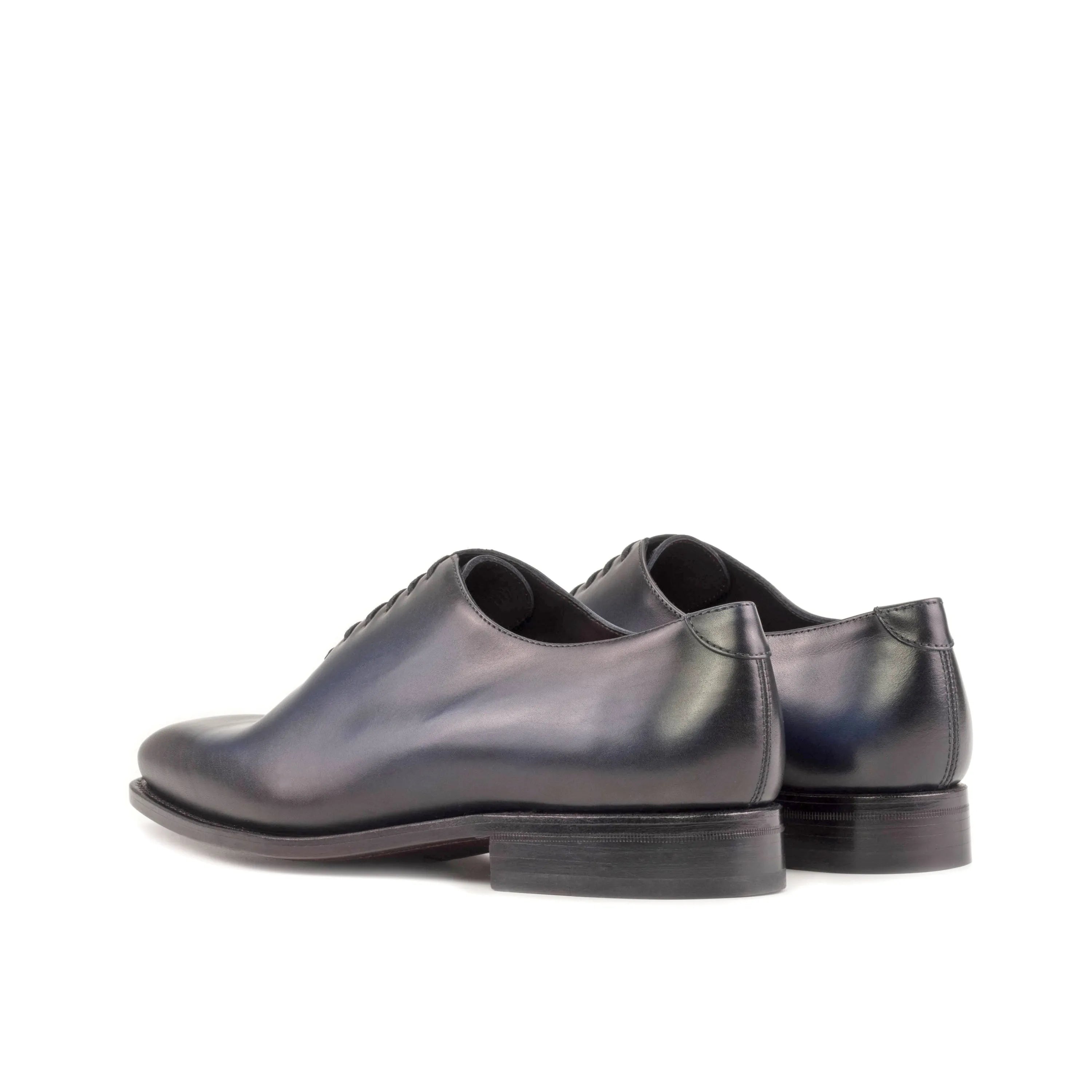 Elegant Pair of dark leather Baron Wholecut shoes for formal occasions