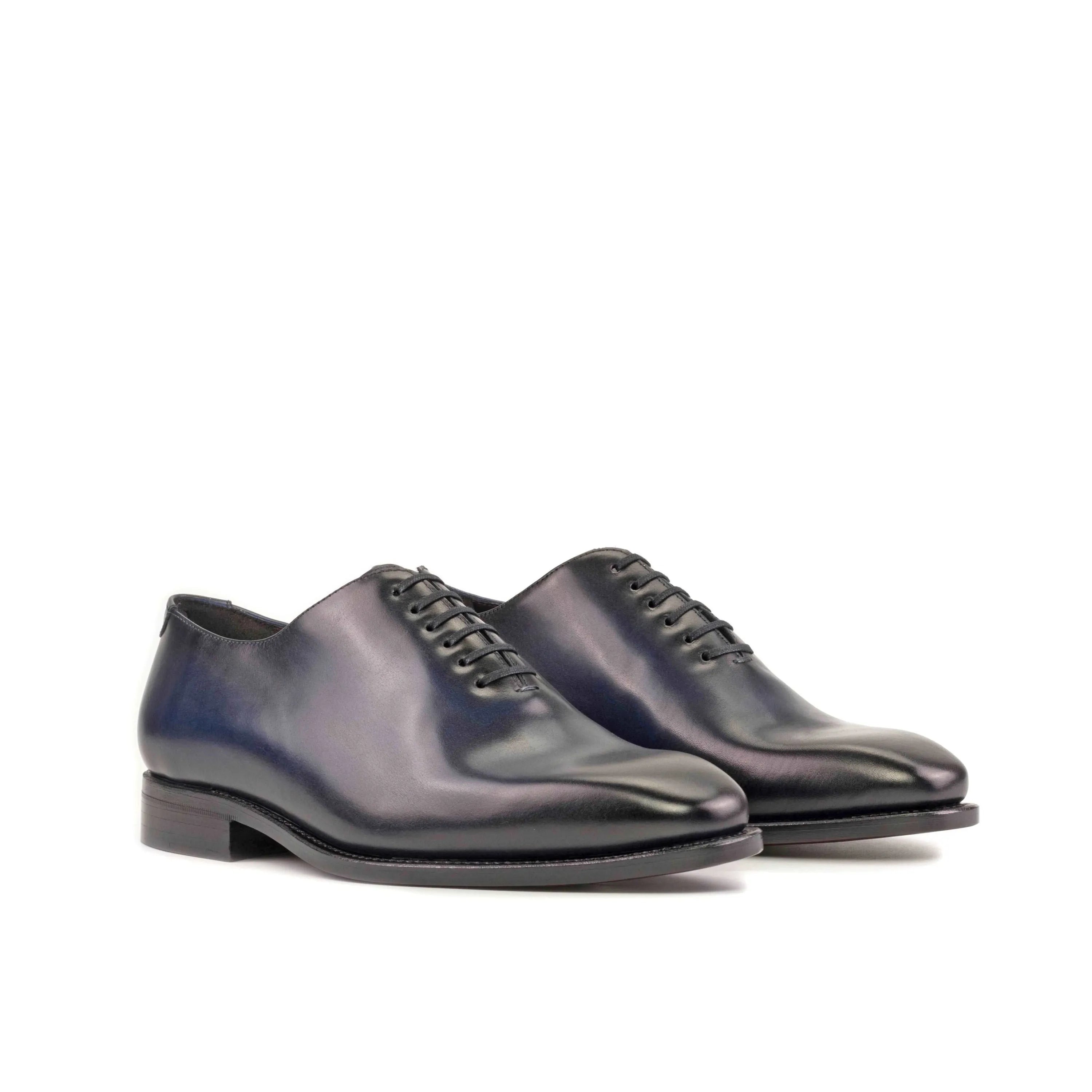 Polished leather Baron Wholecut shoes, exemplifying elegance and craftsmanship