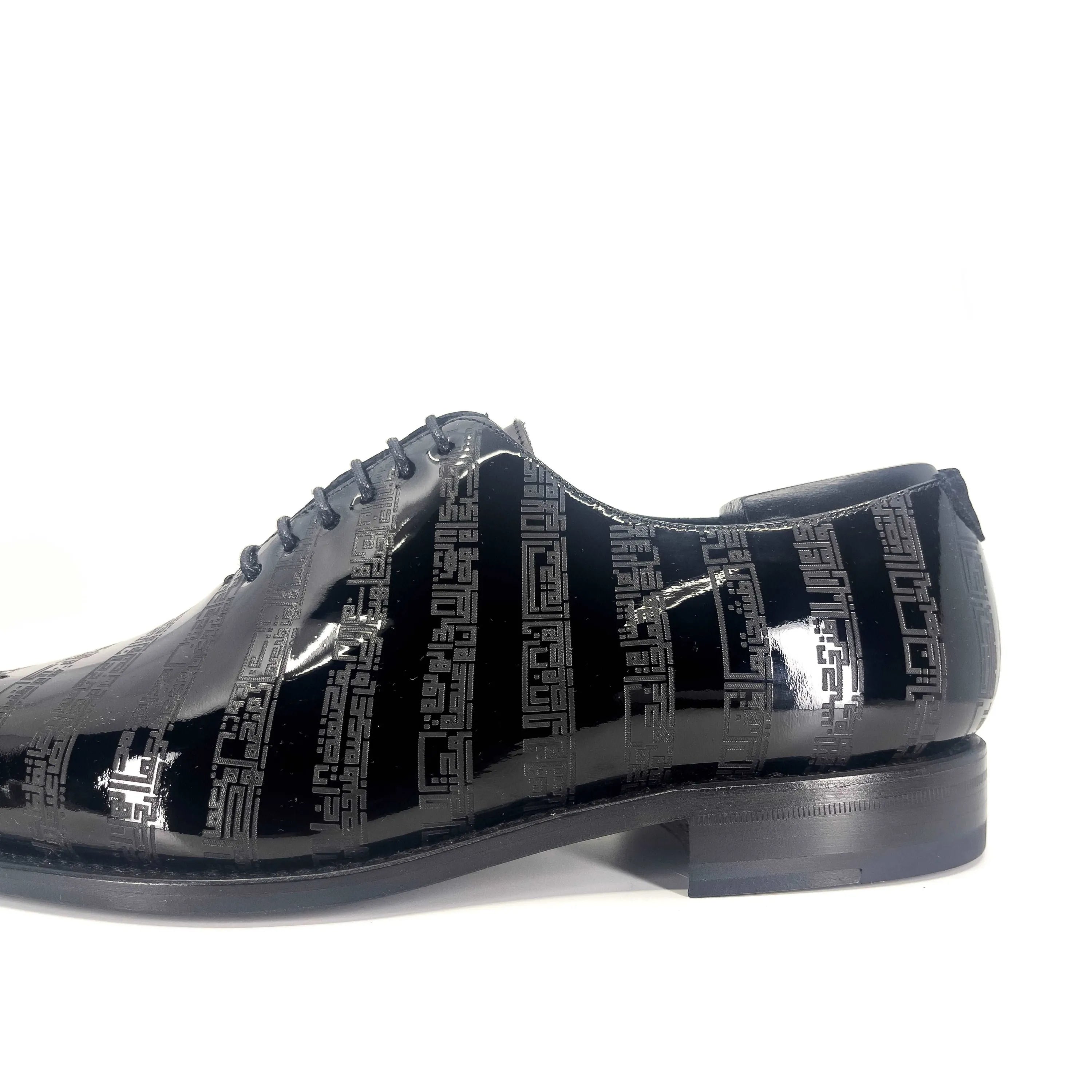 Black patent leather wholecut shoes with geometric pattern from Before The Throne