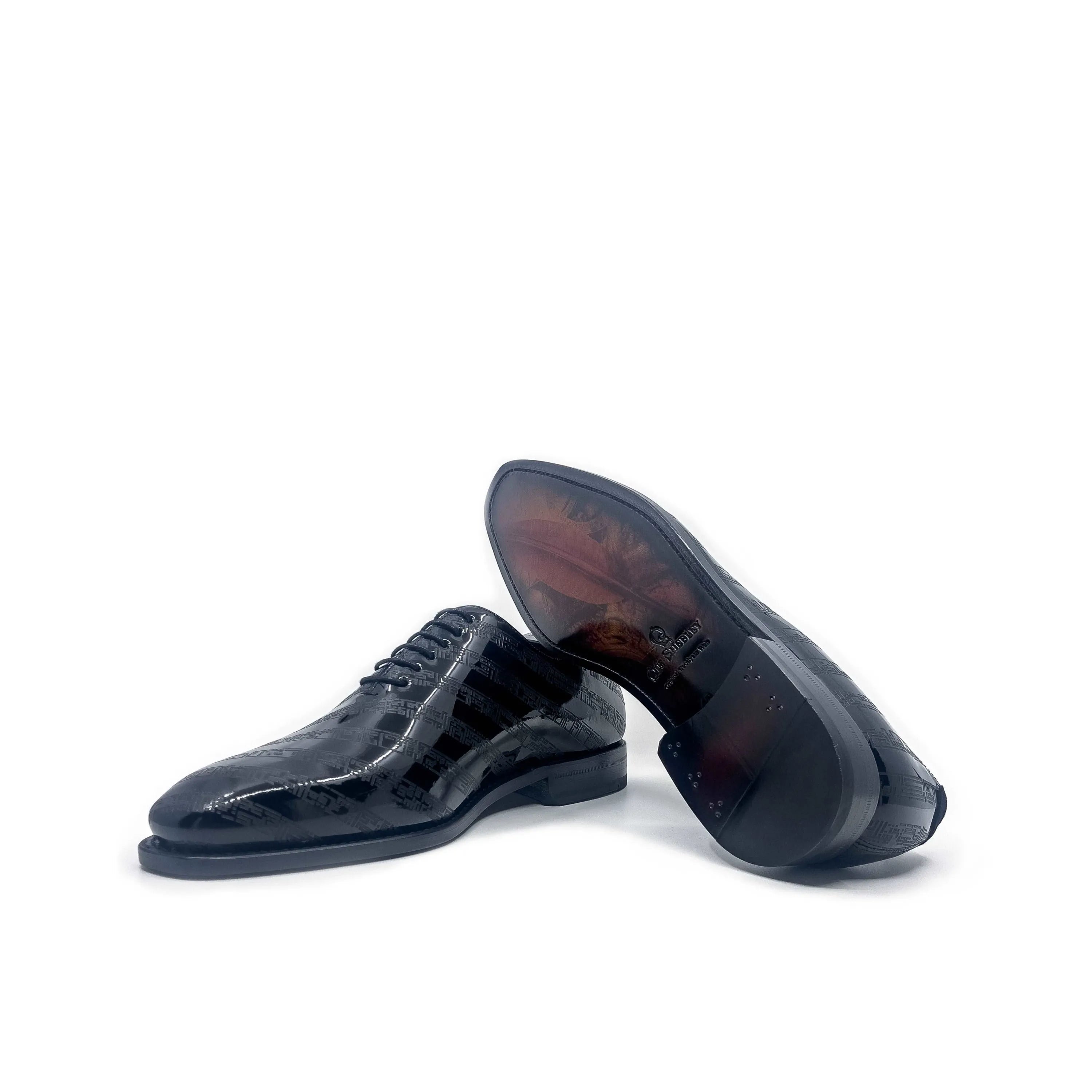 Pair of shiny black dress shoes representing Before The Throne Wholecut Shoes