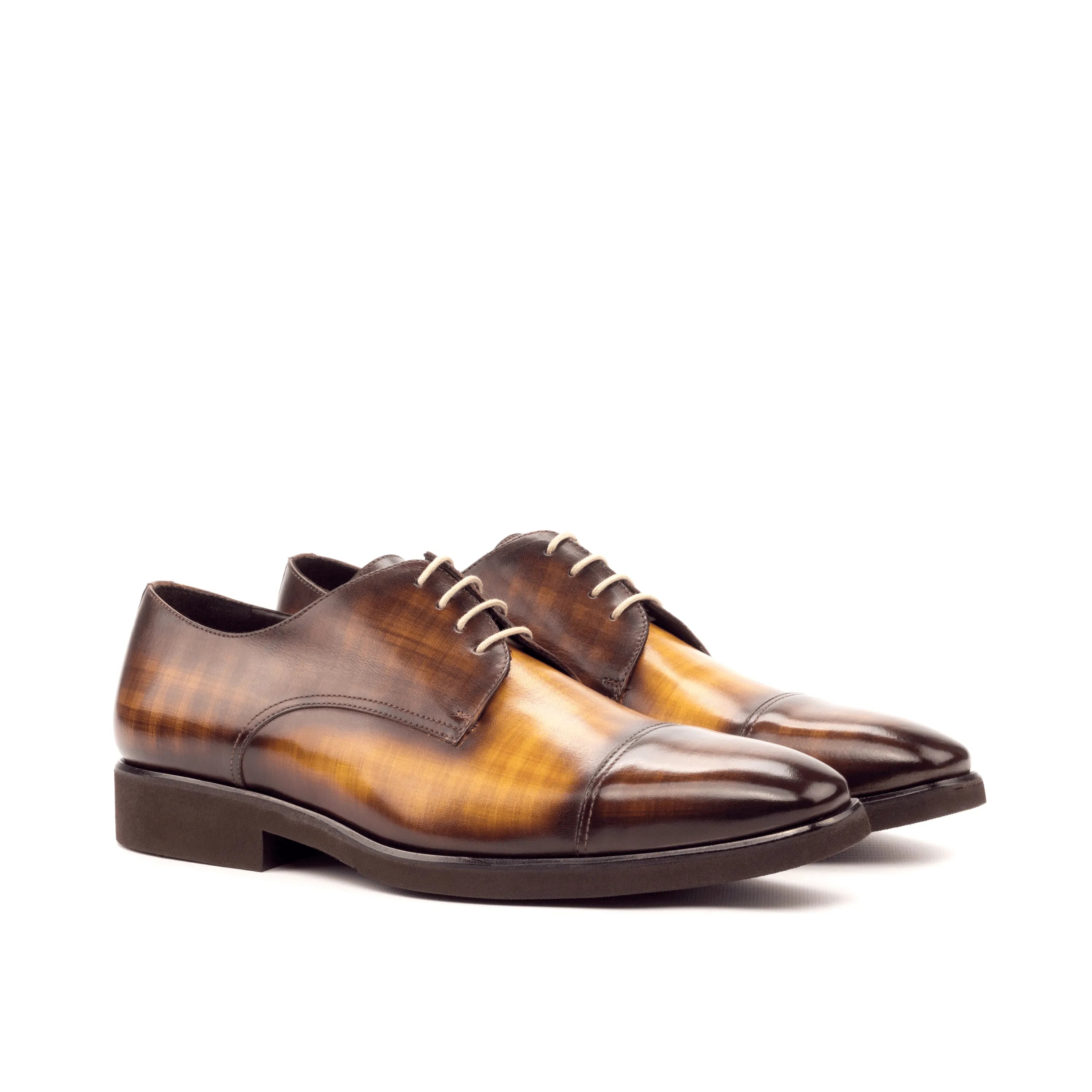 Brown leather dress shoes from the Belem Patina Derby II collection, showcasing premium craftsmanship