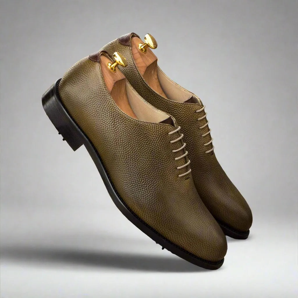 Olive green leather Bogy Wholecut Golf shoes showcasing elegant style in oxford golf design