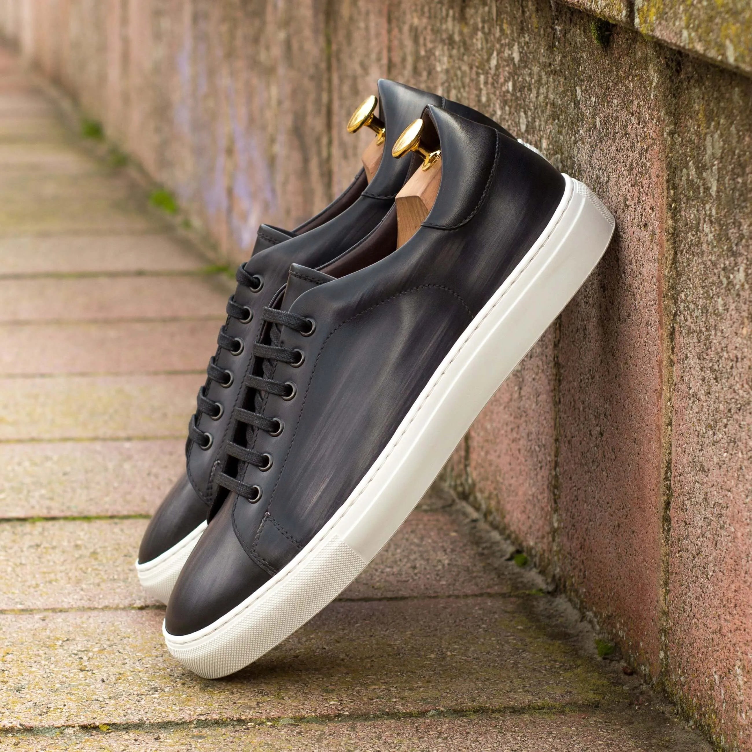 Black leather C68 Trainer Patina sneakers with white cupsole for stylish comfort