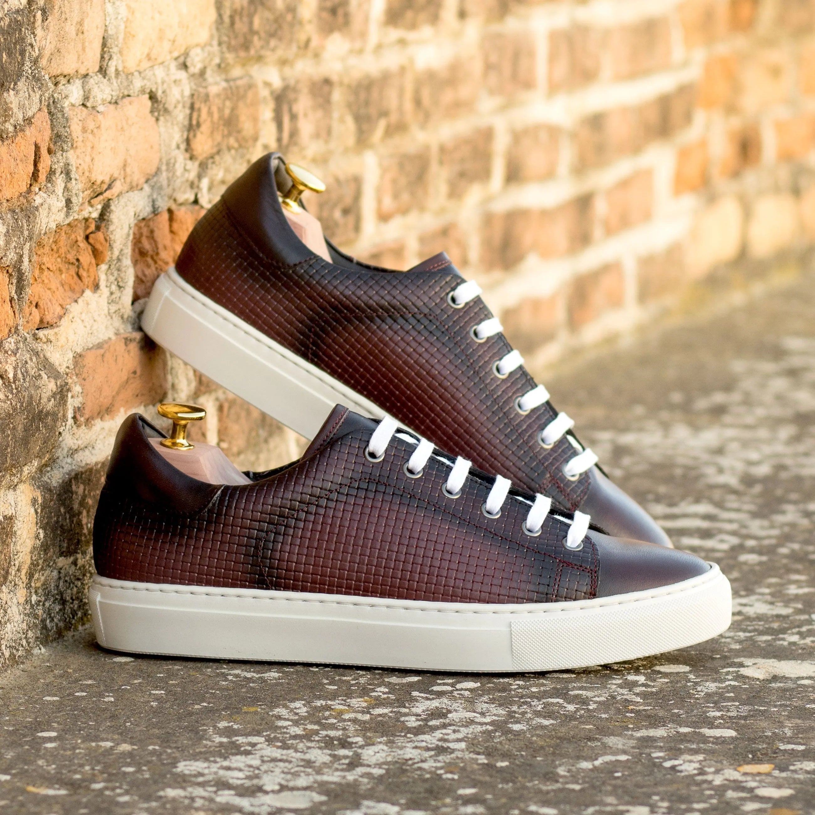 Pair of brown leather sneakers featuring CapaOne Trainer Sneaker design