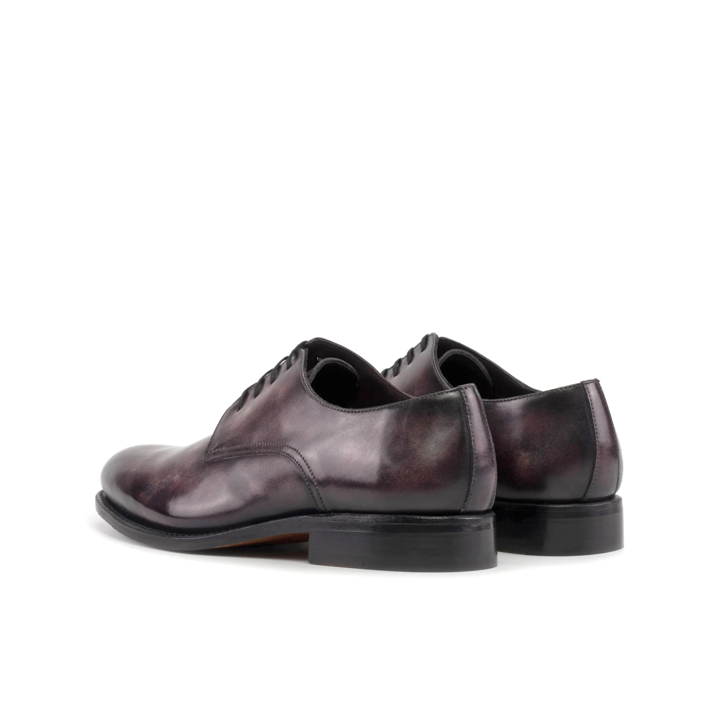Pair of polished leather Capella Patina Derby shoes, exemplifying elegance and quality