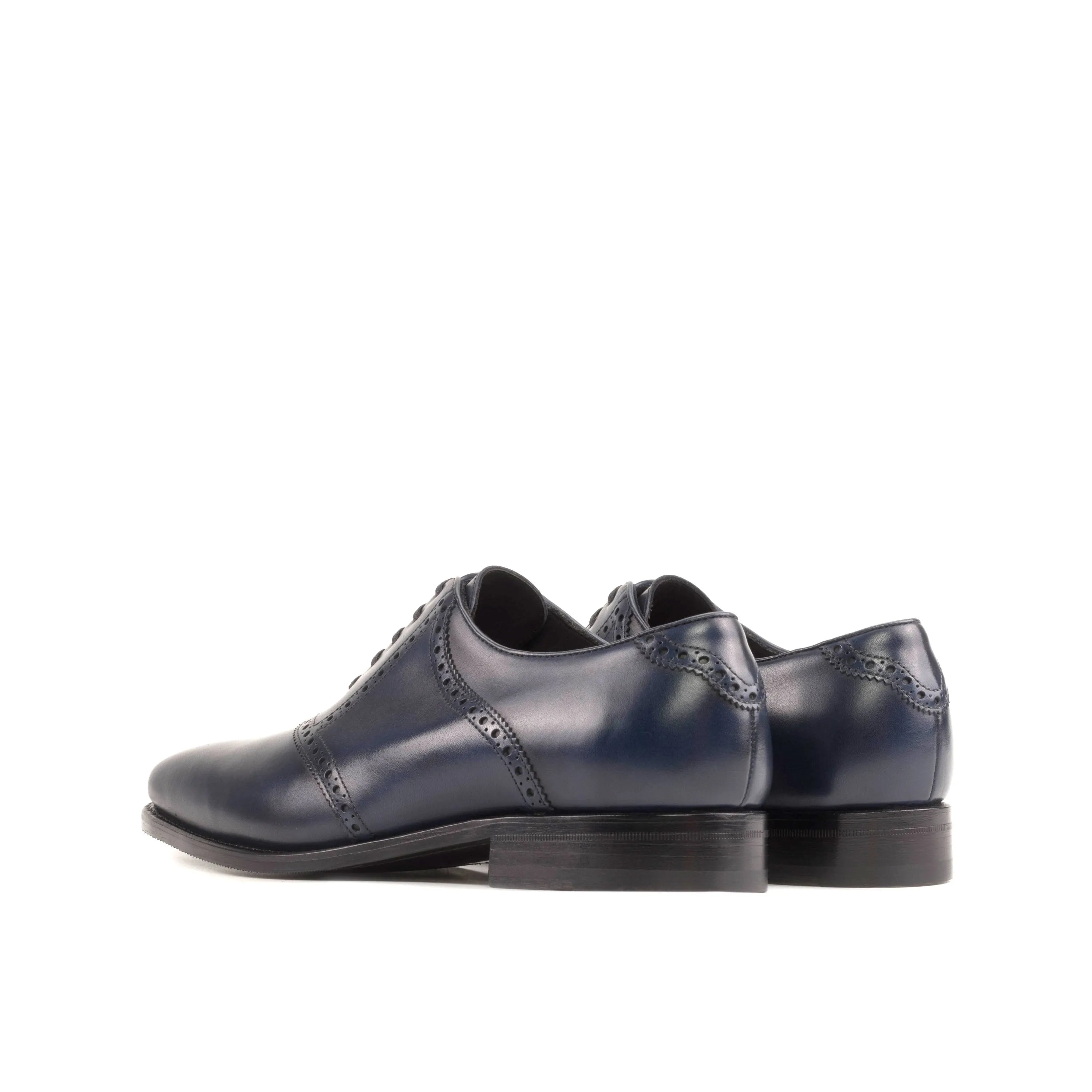 Pair of navy blue leather dress shoes from the Carmine Saddle Shoes collection