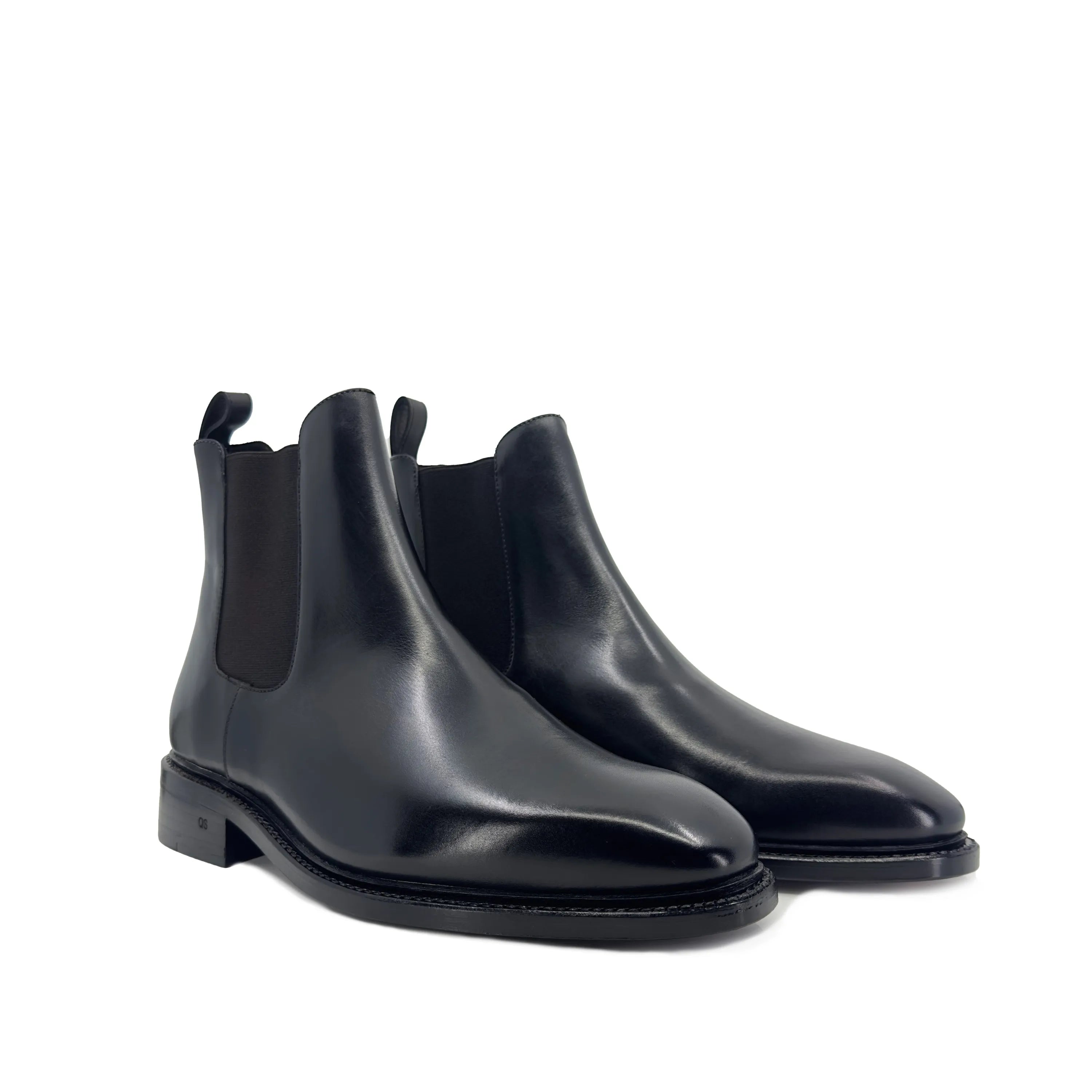 Pair of black leather Cave Chelsea Boots II featuring classic Chelsea boots design