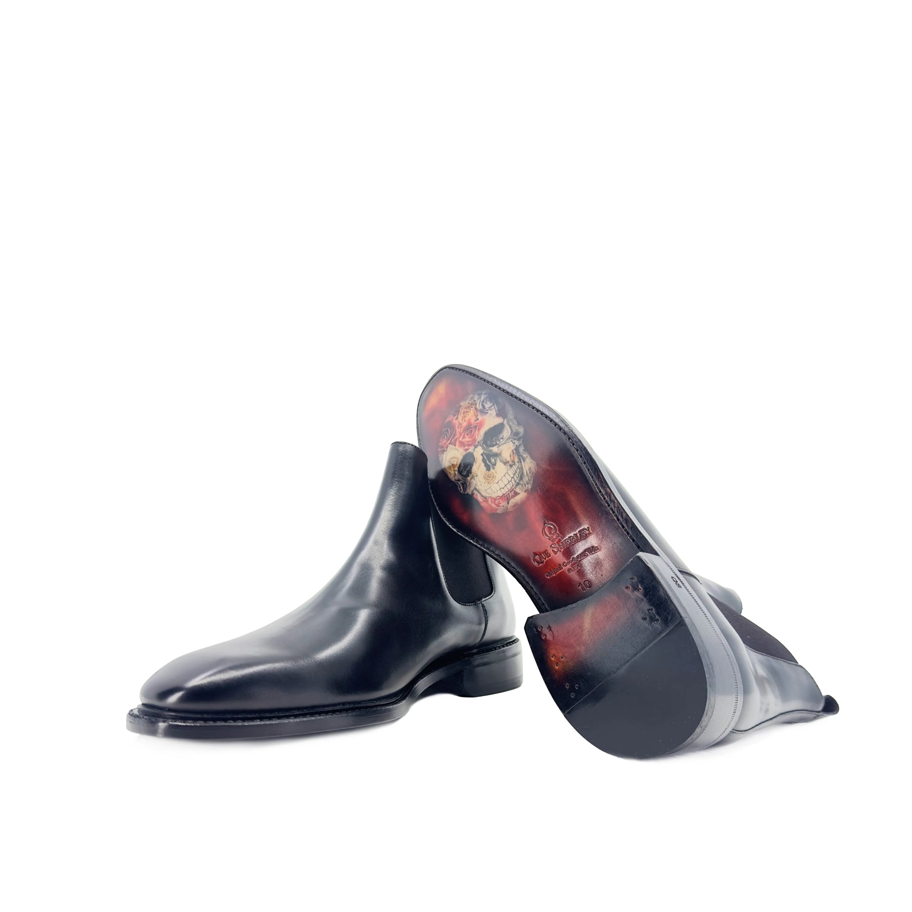 Black leather Cave Chelsea Boots II featuring decorative soles for stylish versatility