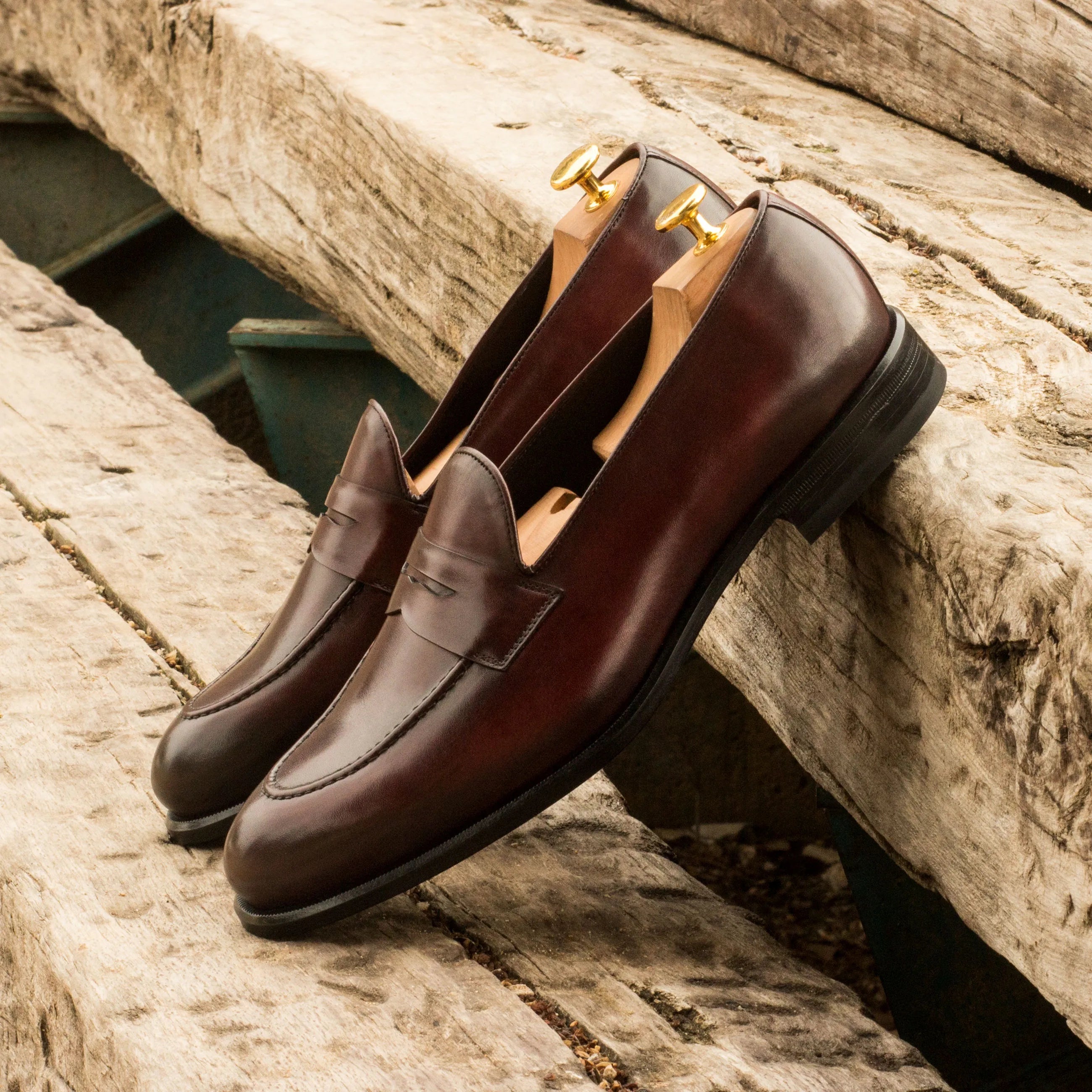 Pair of Cayuga Loafers II featuring rounded toe design in rich brown leather