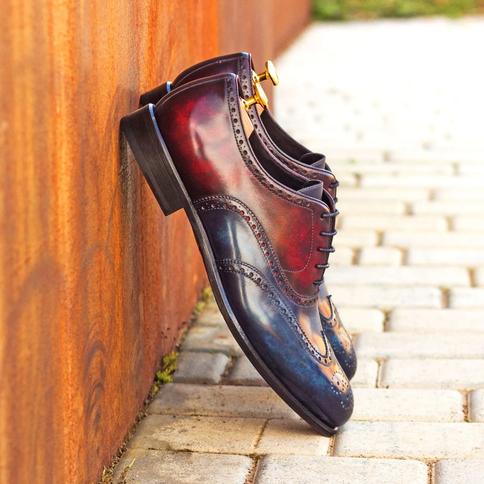 Burgundy and blue leather Celestial Patina Longwing Blucher dress shoes displayed elegantly