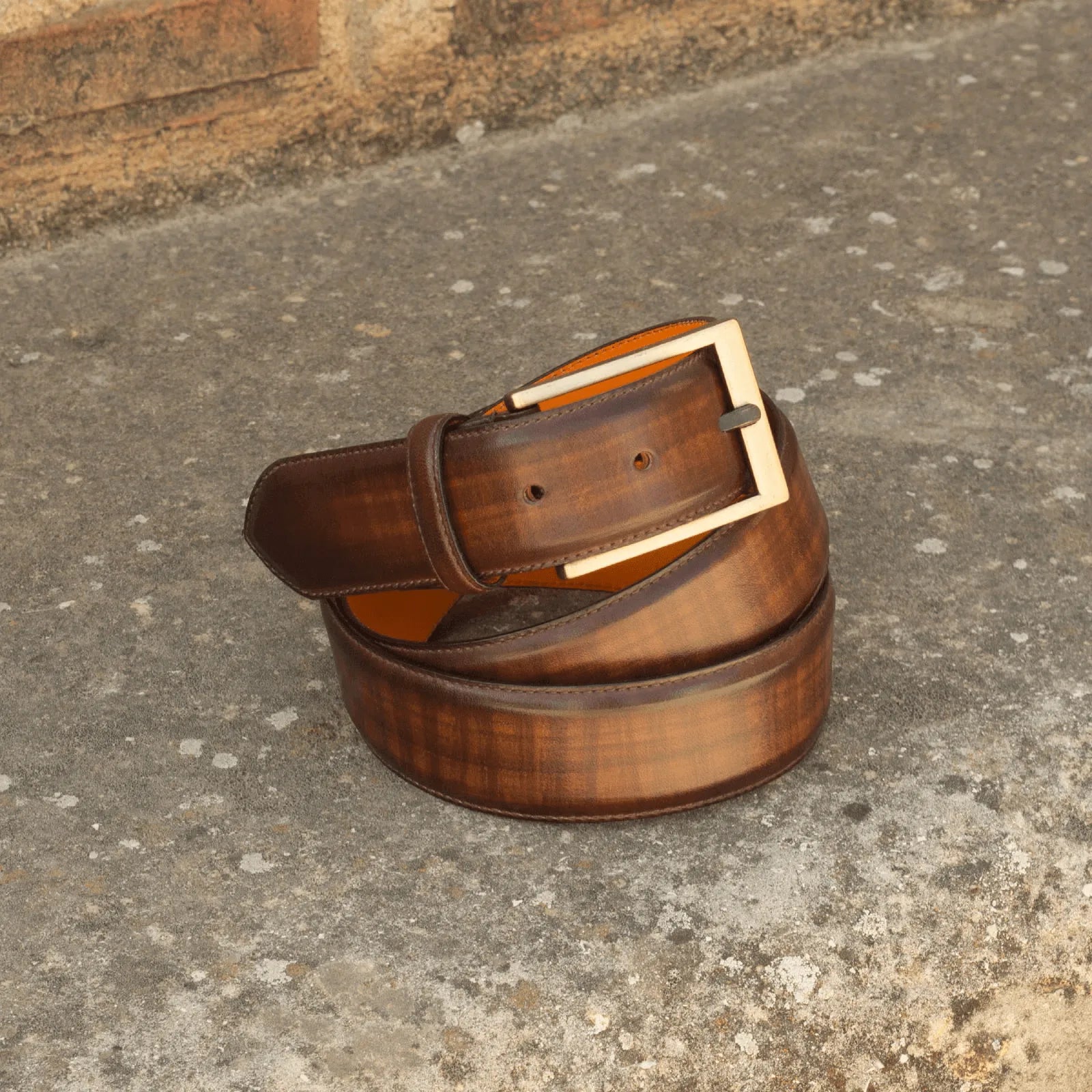 Brown leather Cheung Patina Hampton belt with a gold buckle for elegant style