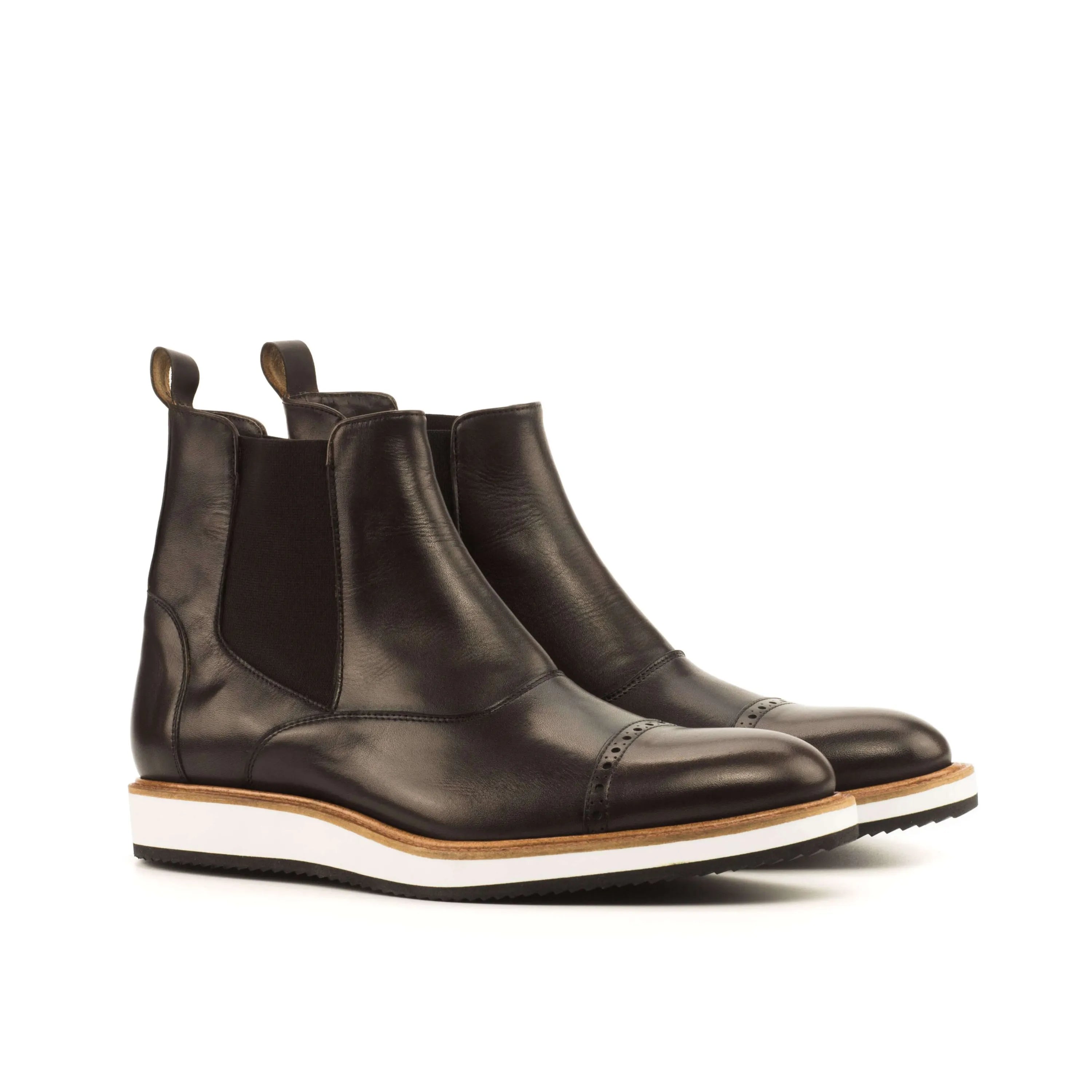 Pair of brown leather Choovio Chelsea Boots displayed against a neutral background