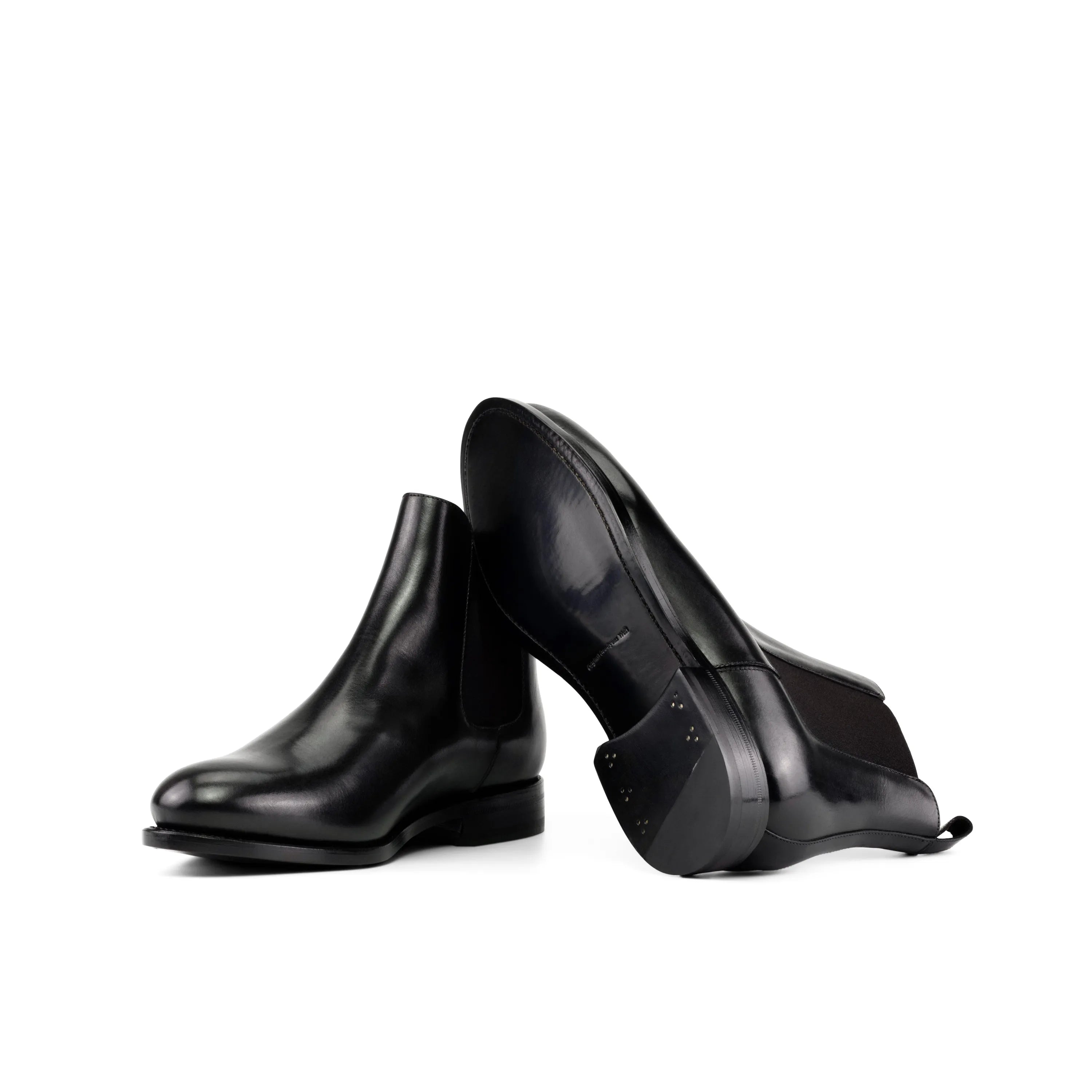 Pair of black leather Ciro Chelsea Boots showcasing modern style and versatility