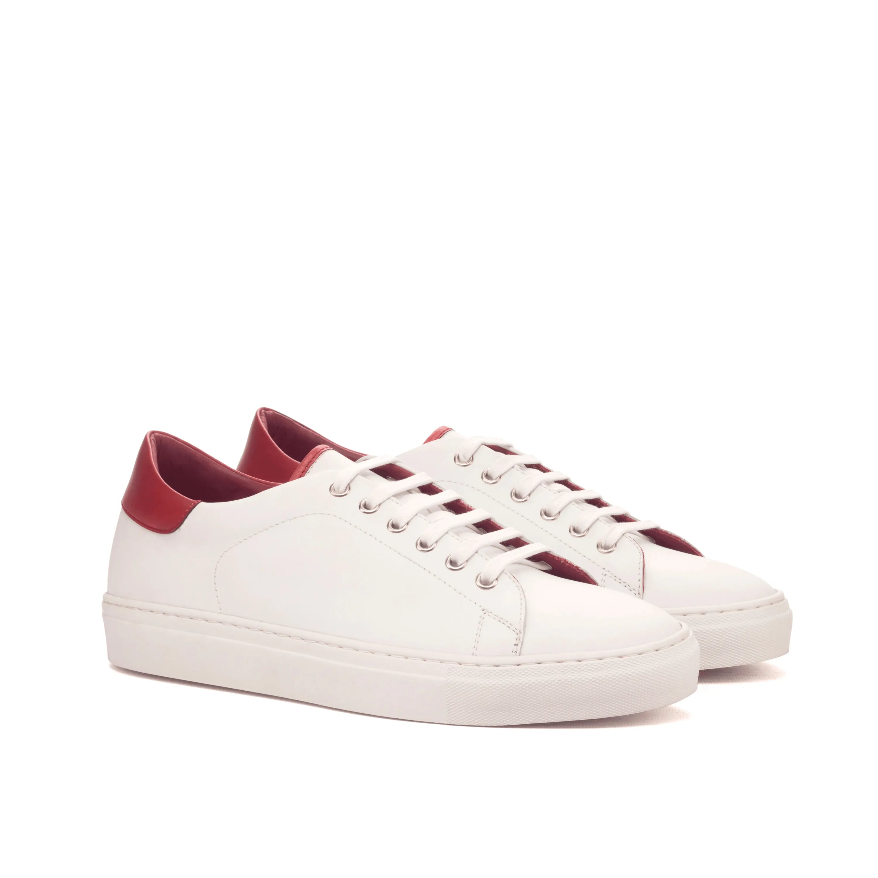 White leather Cyril Trainer Sneaker II featuring vibrant red accents for a stylish look
