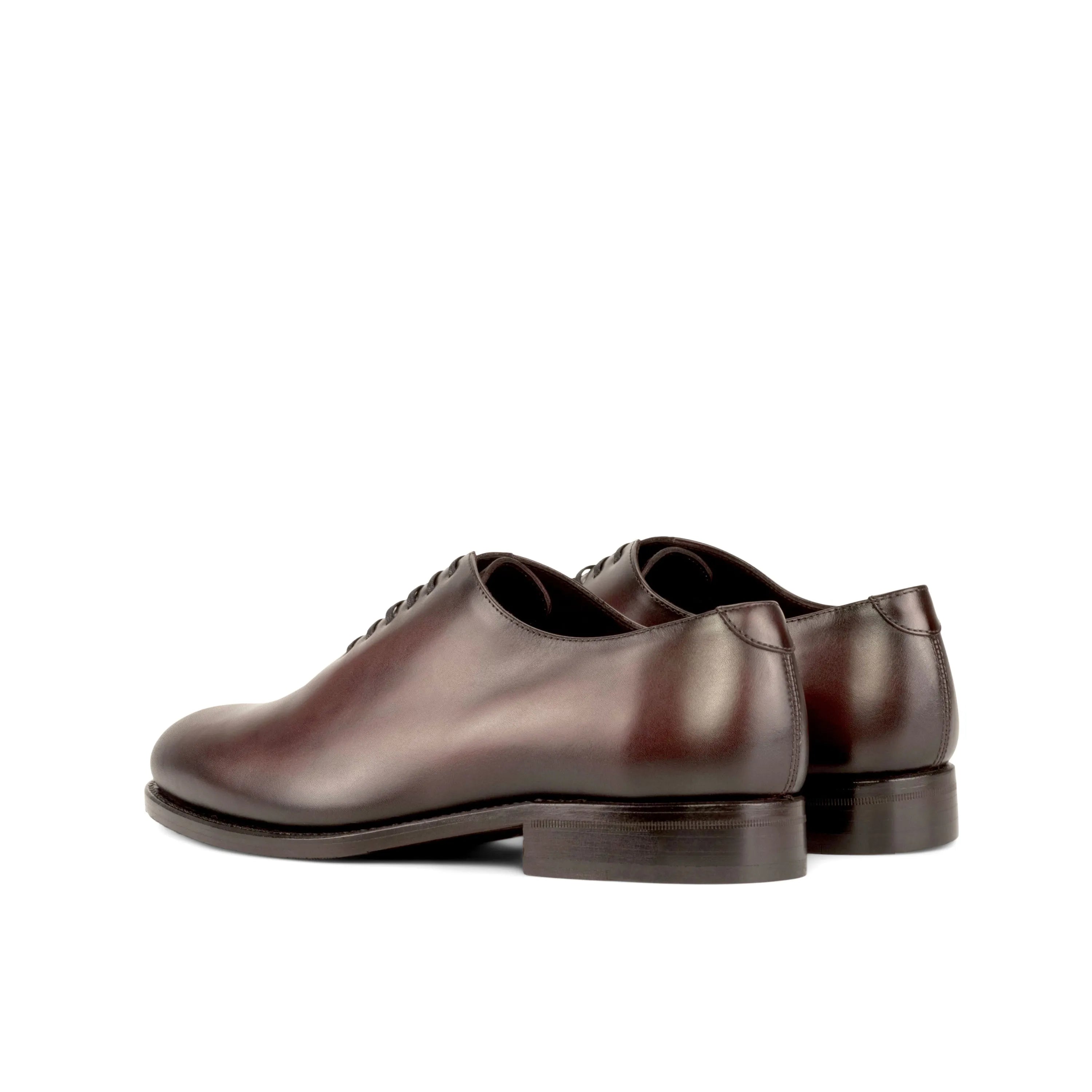 Pair of brown leather dress shoes featuring Daniels Wholecut shoes design