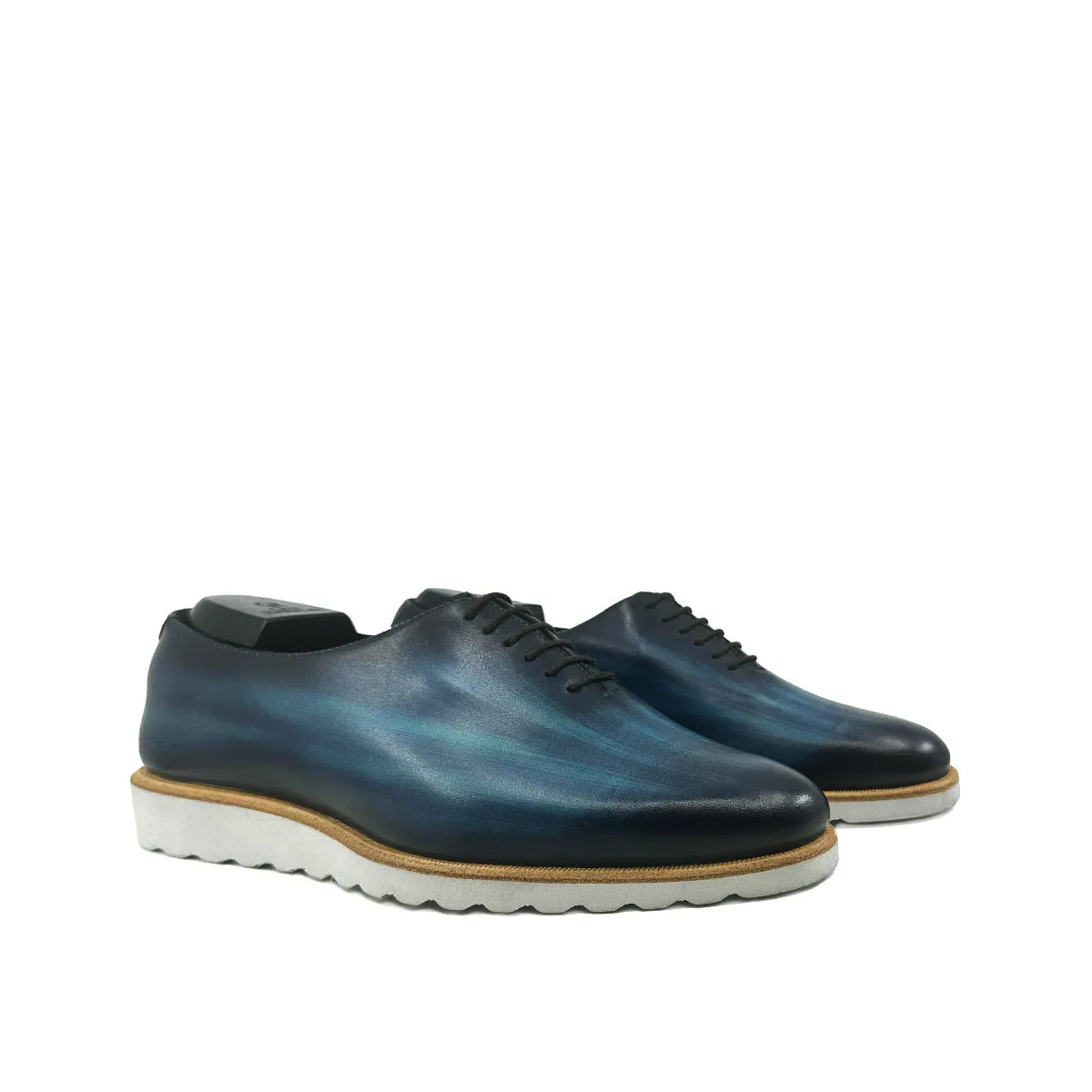 Blue leather Danny Patina Wholecut dress shoes showcasing exquisite craftsmanship