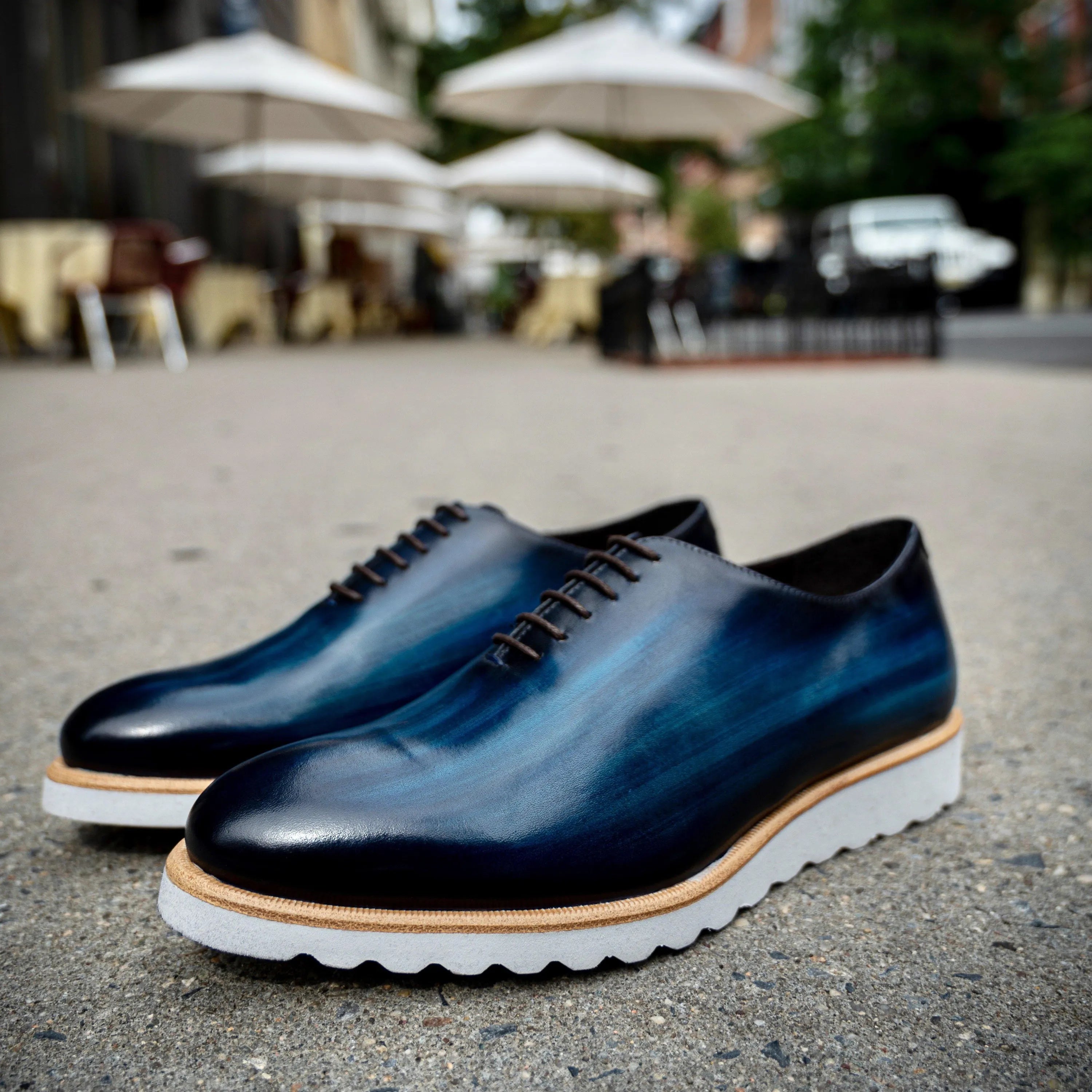 Blue leather dress shoes named Danny Patina Wholecut, ideal for formal occasions