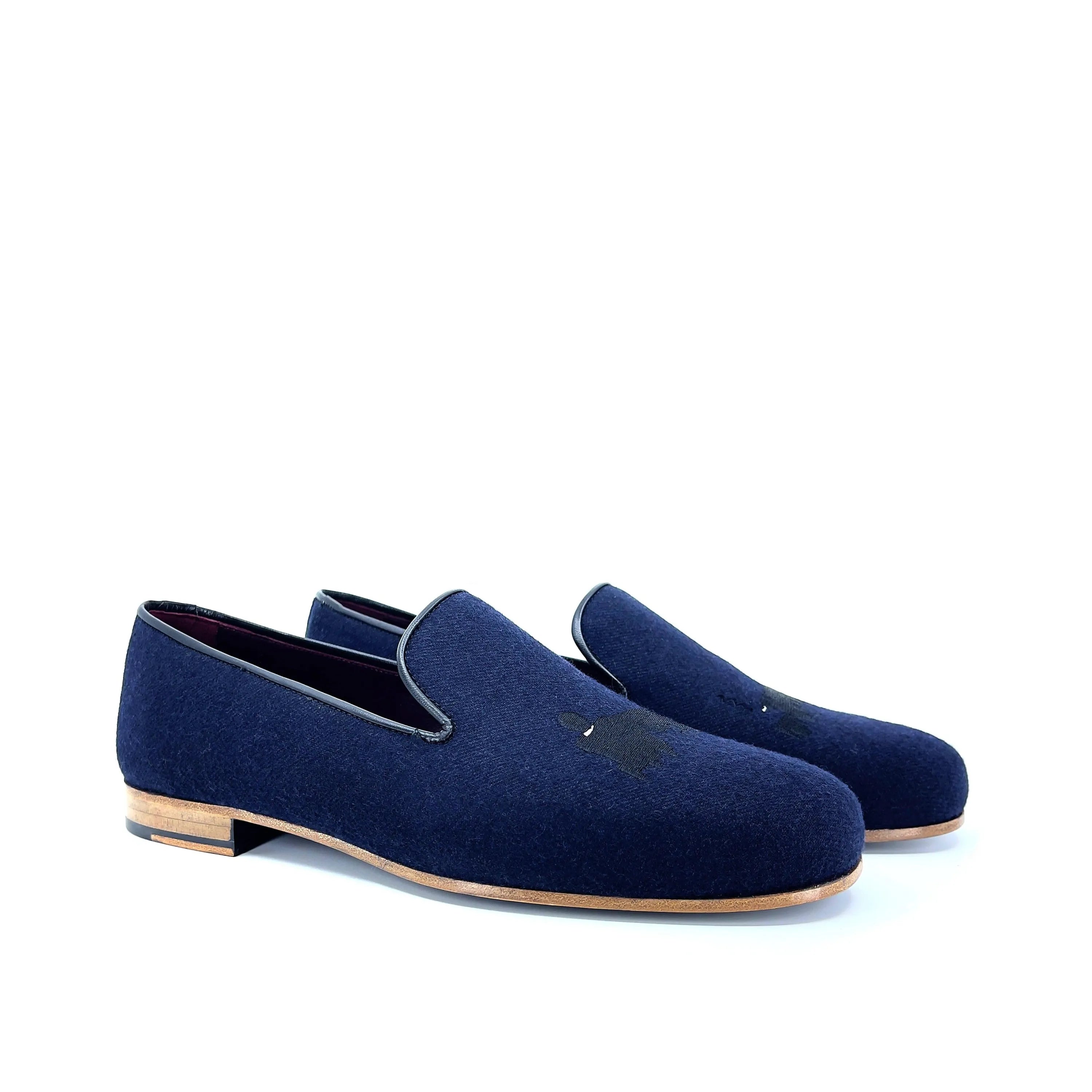 Pair of navy blue loafers featuring DDrapper Wellington Slipon design for stylish comfort