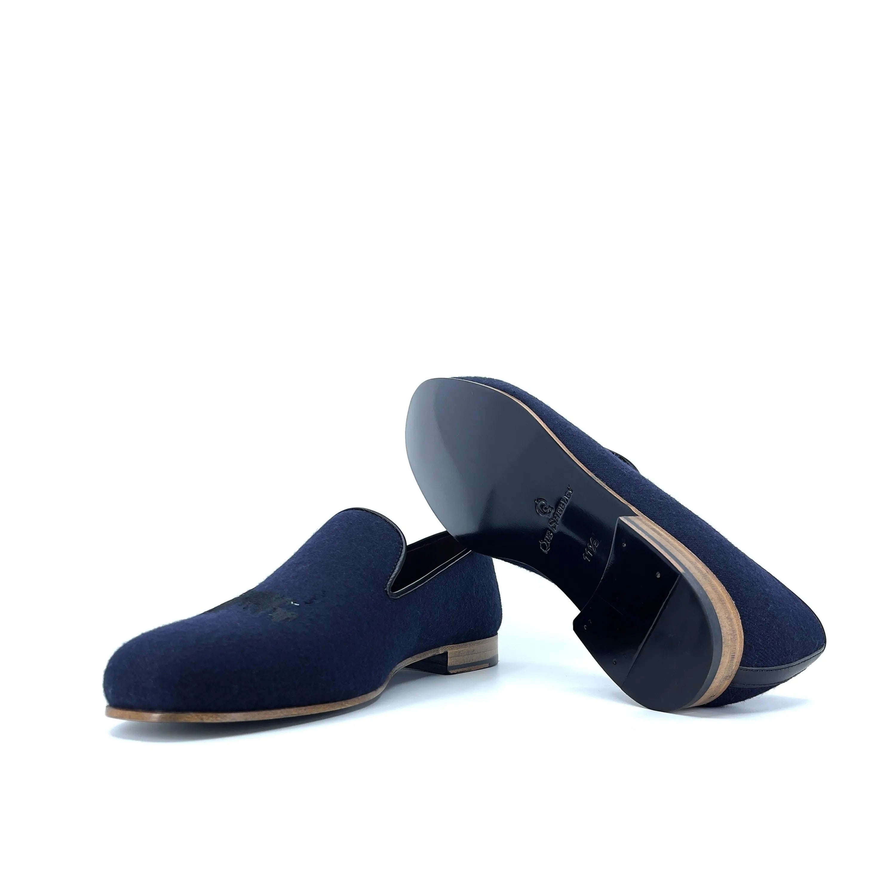 Pair of navy blue suede loafers from the DDrapper Wellington Slipon collection