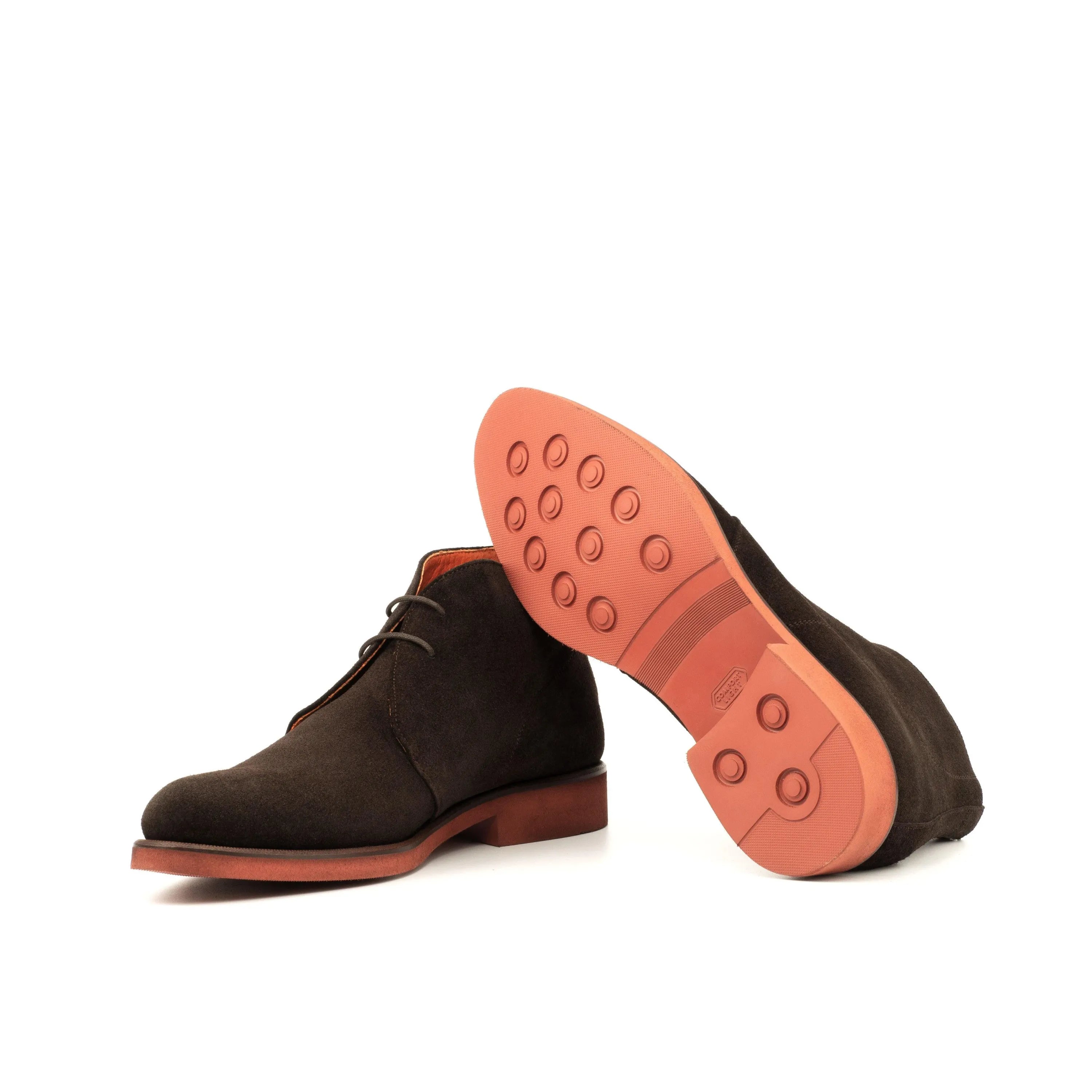 Brown suede Demothi Chukka boots with distinctive orange soles