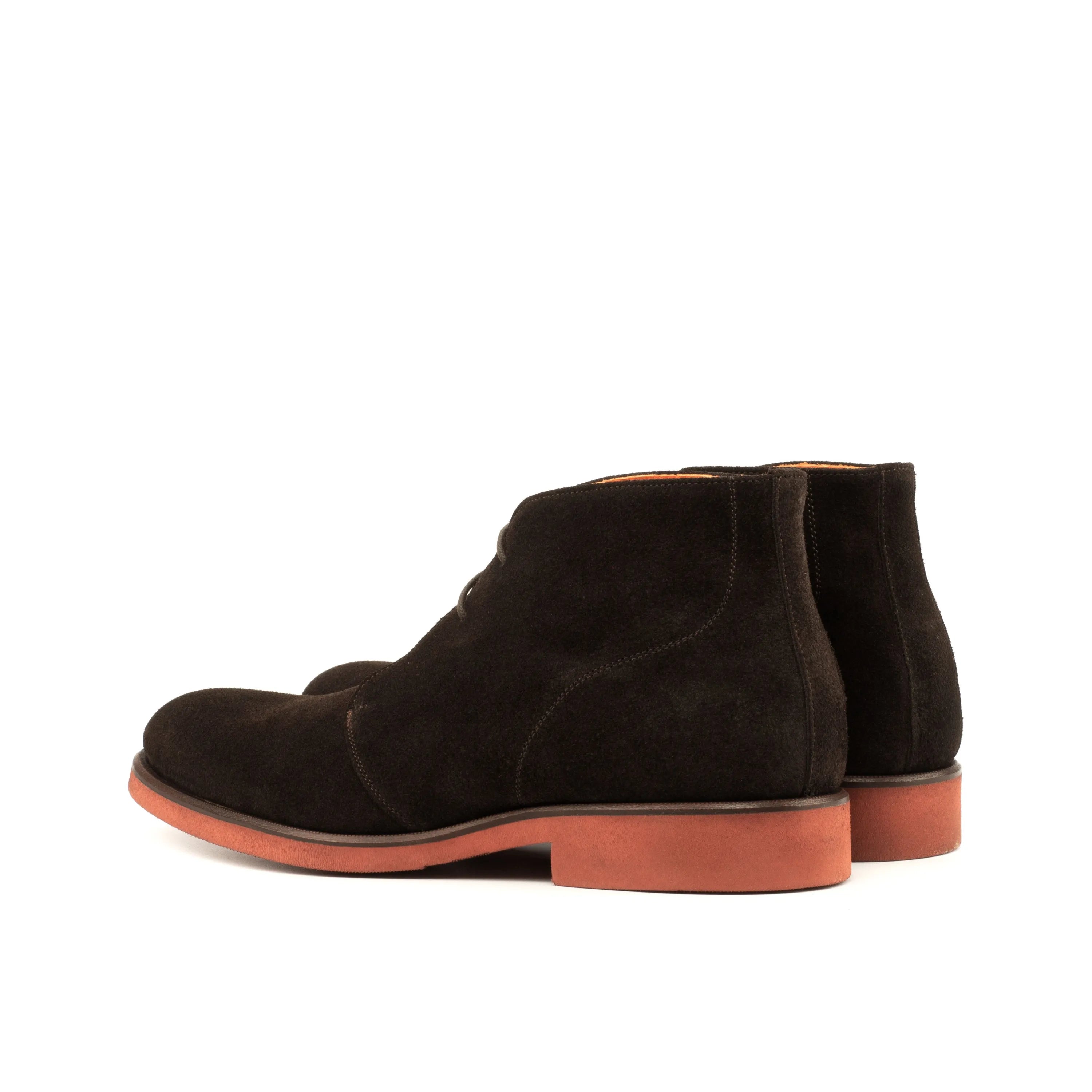 Brown suede Demothi chukka boots with vibrant red soles for stylish comfort