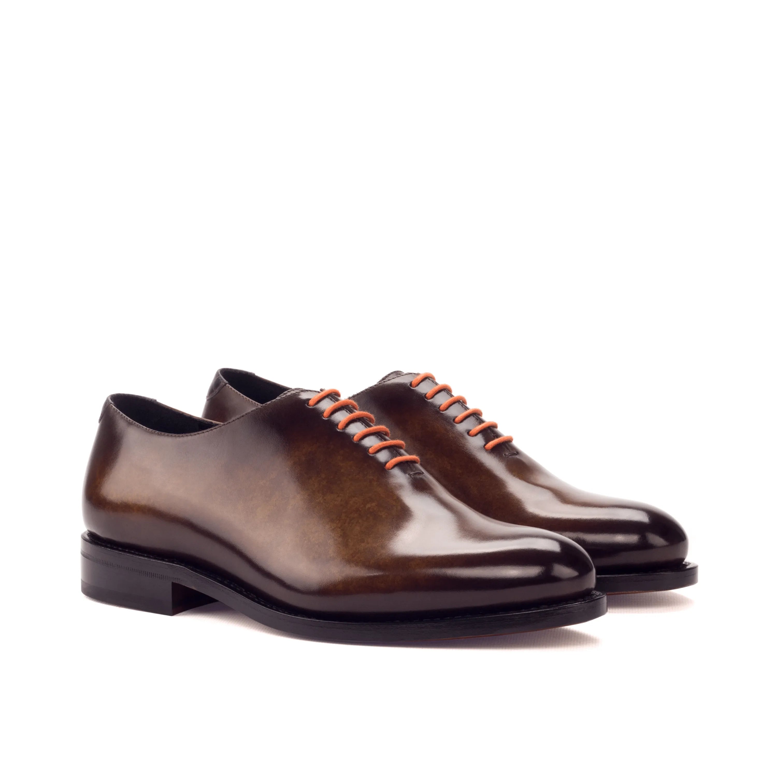 Pair of brown leather dress shoes named Dillinger Whole Cut Patina, luxury bespoke shoes for men
