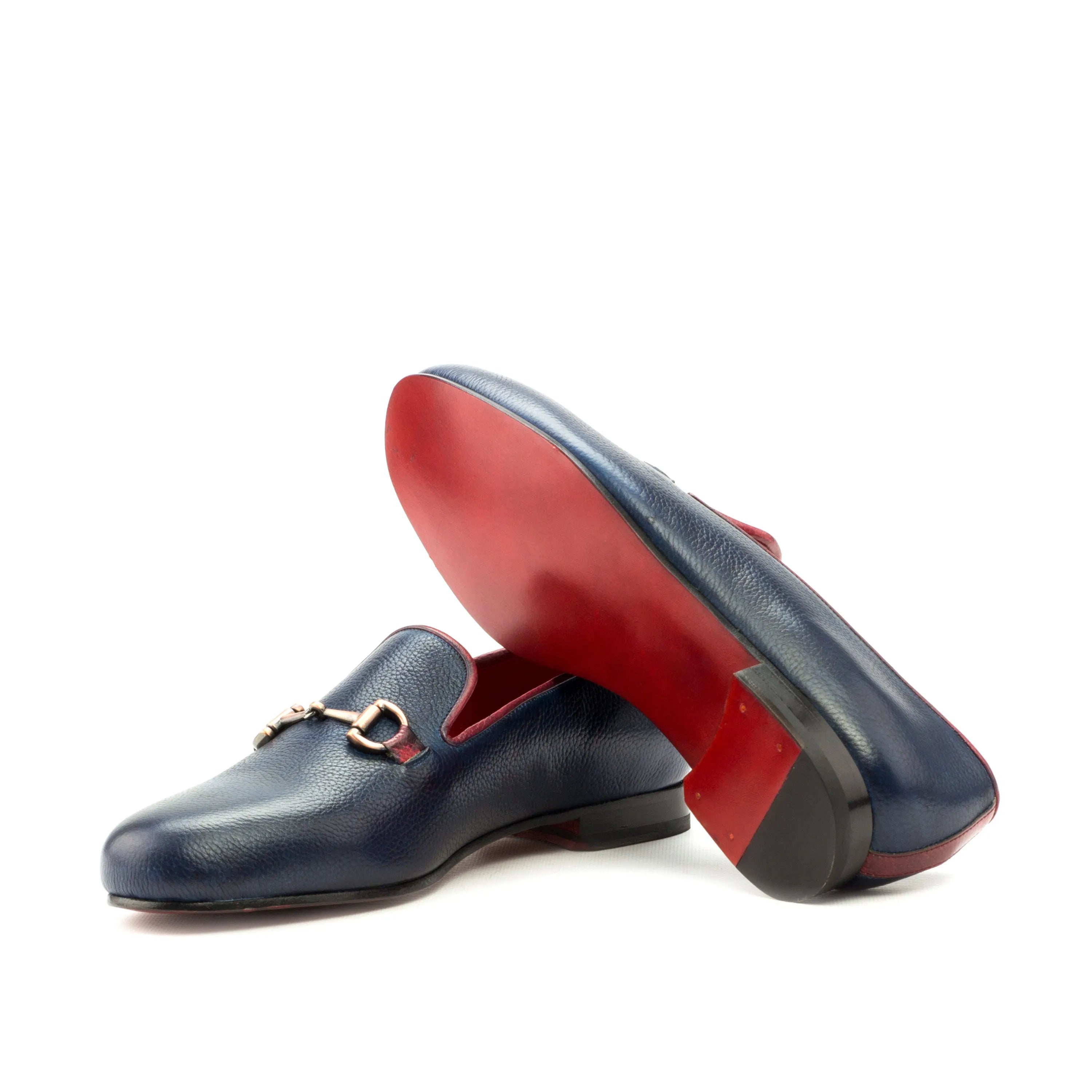 Blue leather Dios Wellington Slipon loafers featuring stylish red soles
