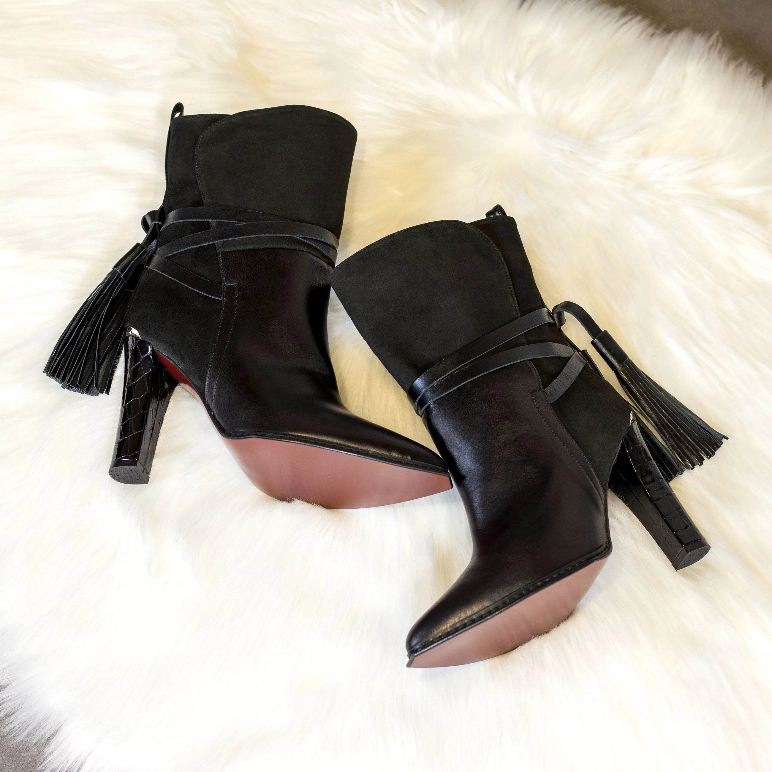 Pair of black leather ankle boots with tassels from Donna Lyon High Heel Booties II