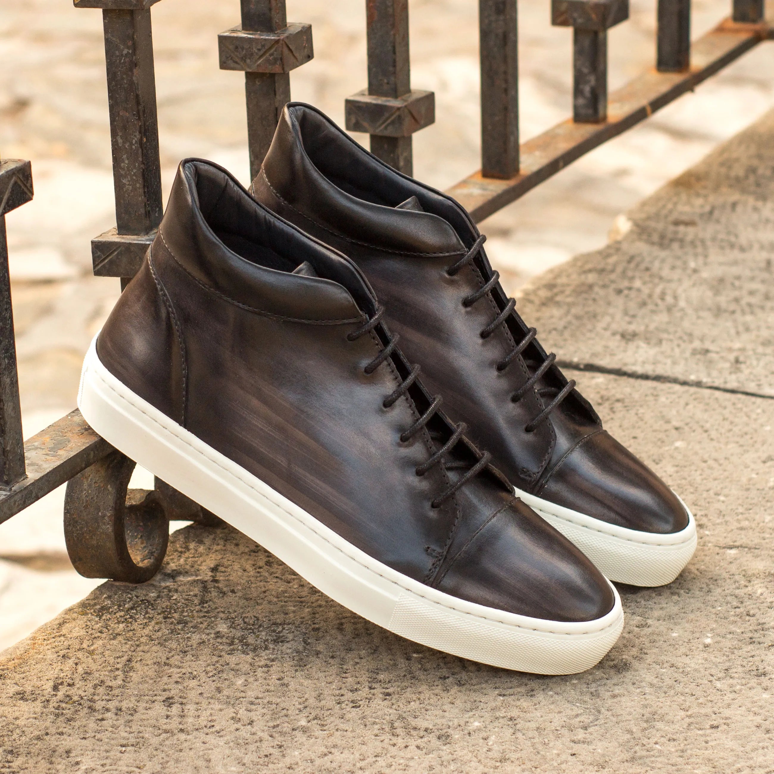 Pair of dark leather high-top sneakers from Donny Patina High Top Sneakers II collection