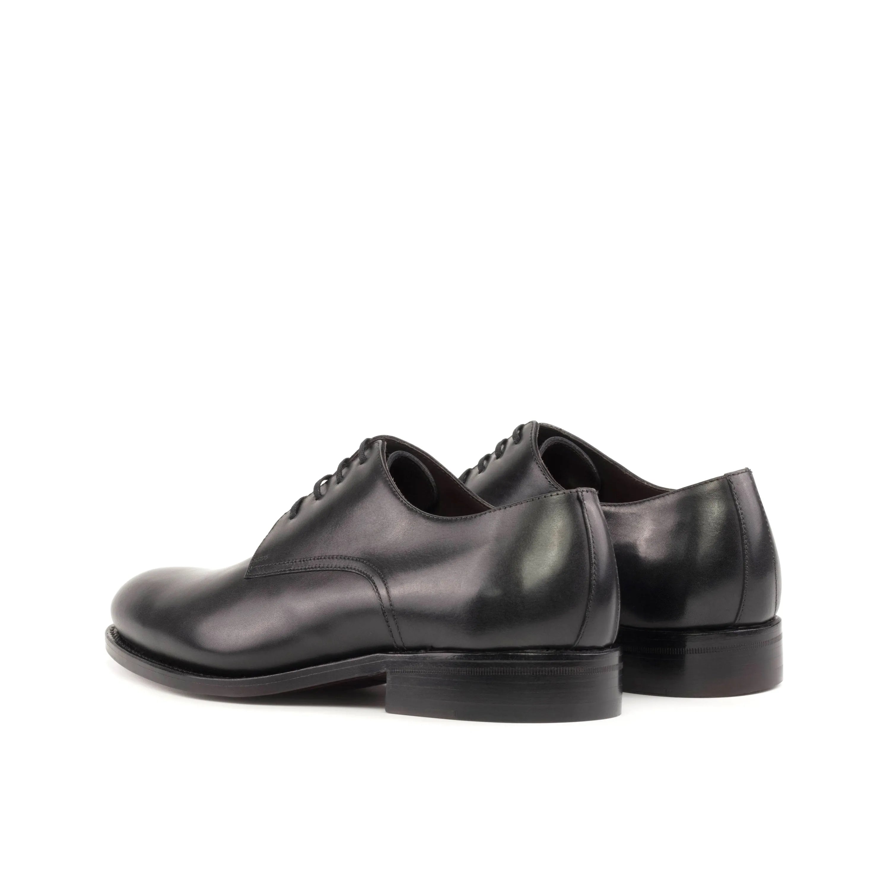 Pair of black leather Edanos Derby shoes II showcasing elegance and style in Fast Lane design
