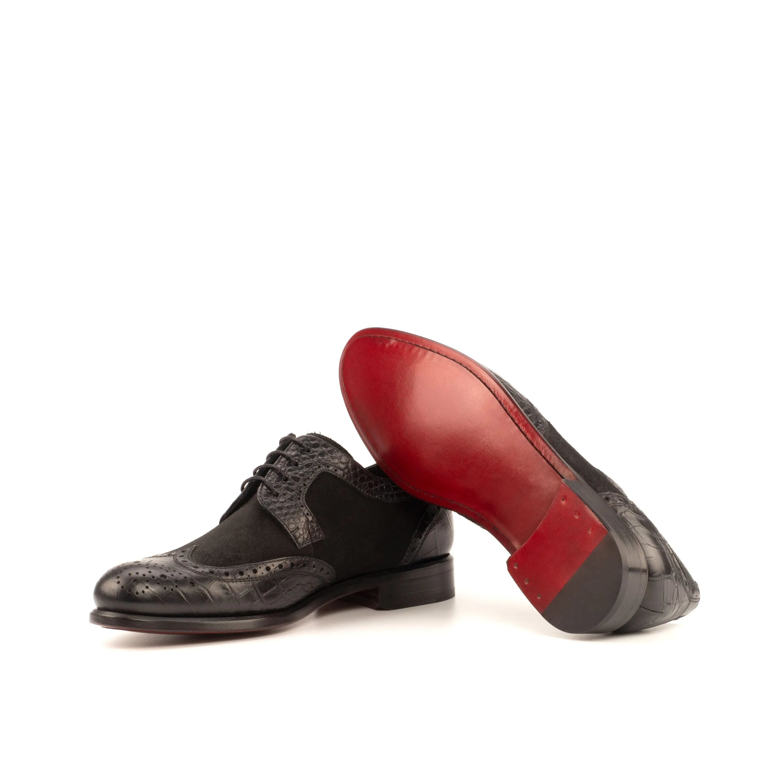 Black leather Ema Ladies Derby Wingtip shoes with striking red soles for elegant style